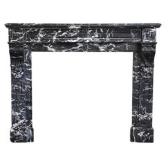 antique fireplace from the 19th century in Nero Marquina marble style Louis XVI