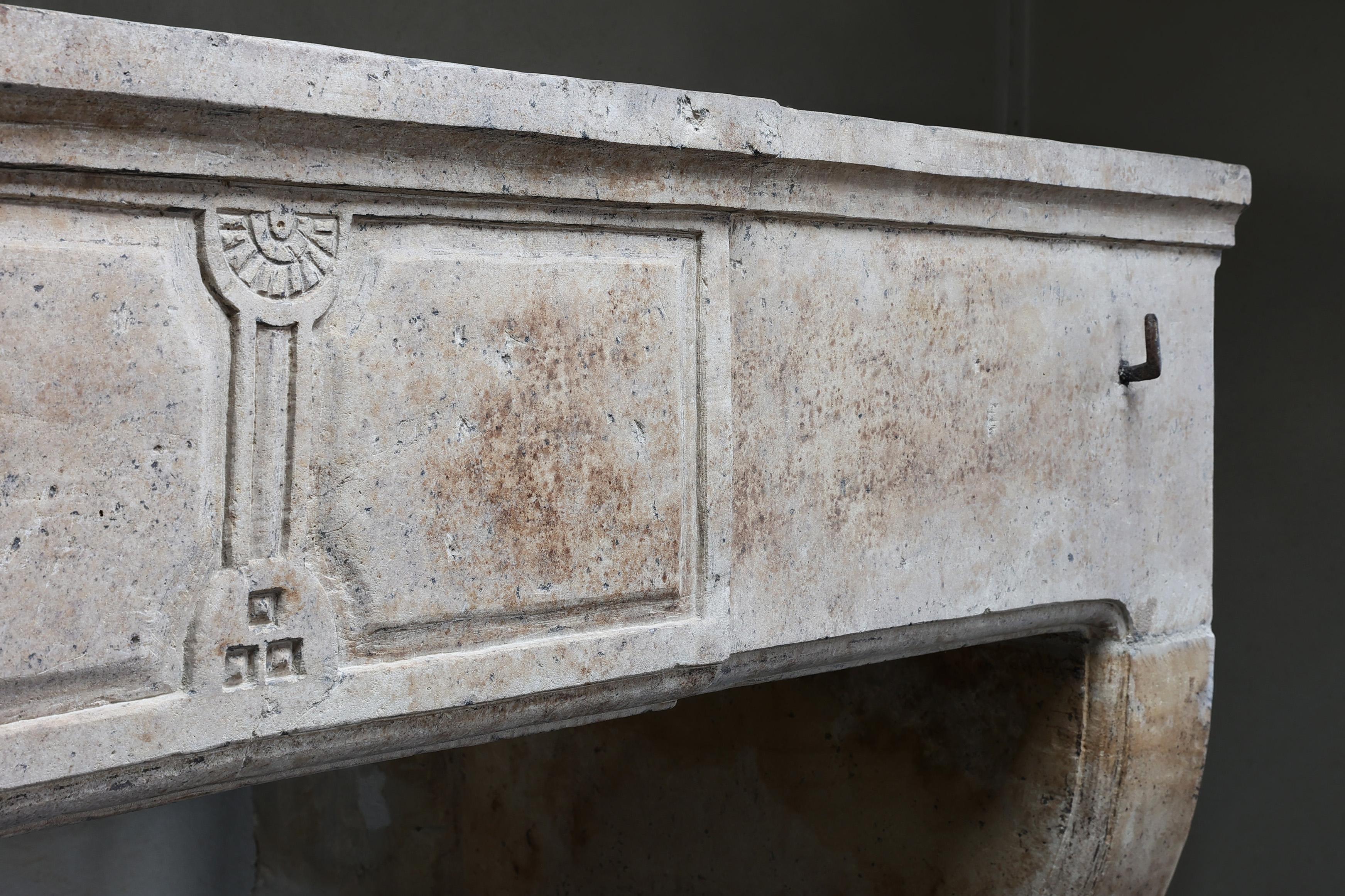French Antique Fireplace from the 19th century of french limestone 