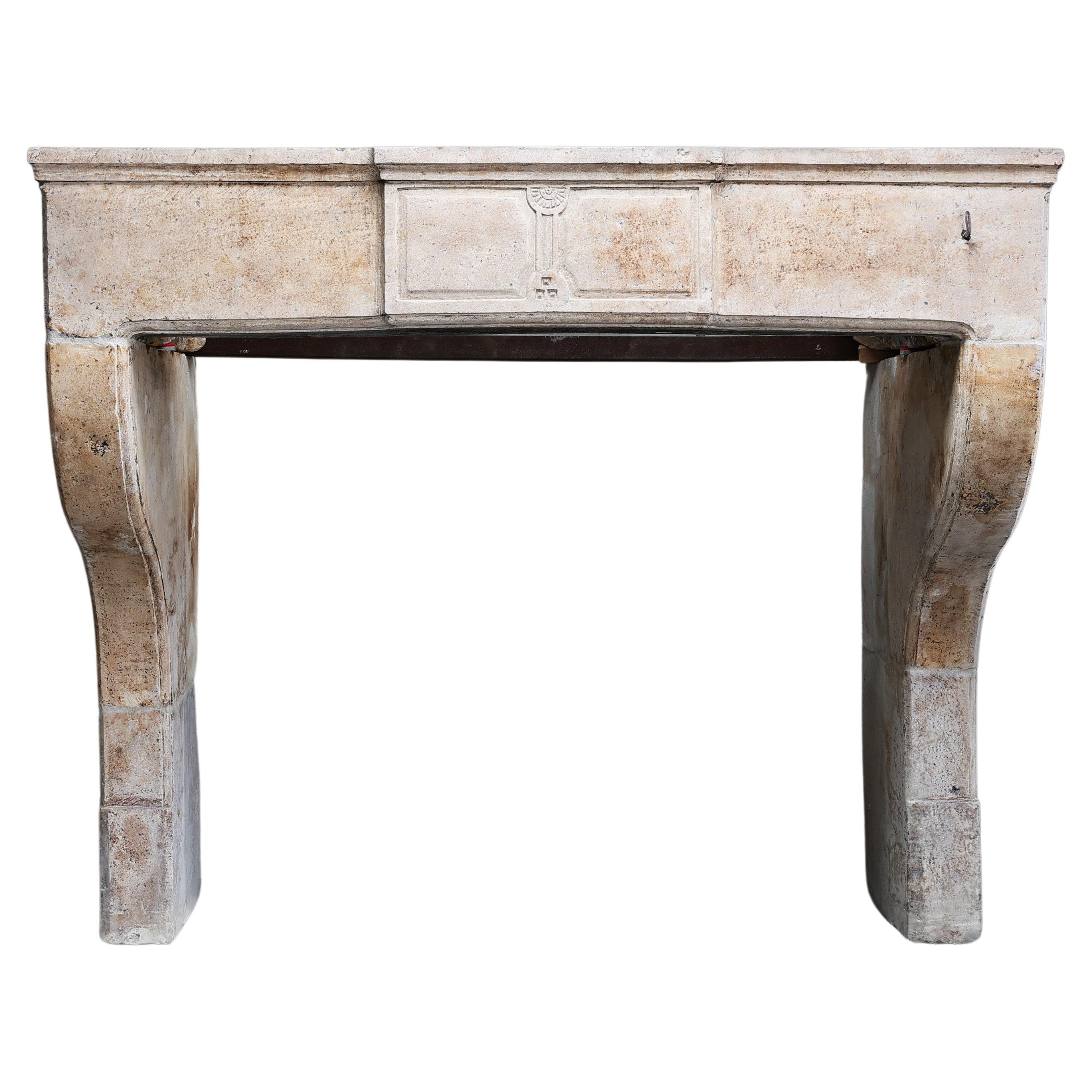 Antique Fireplace from the 19th century of french limestone 