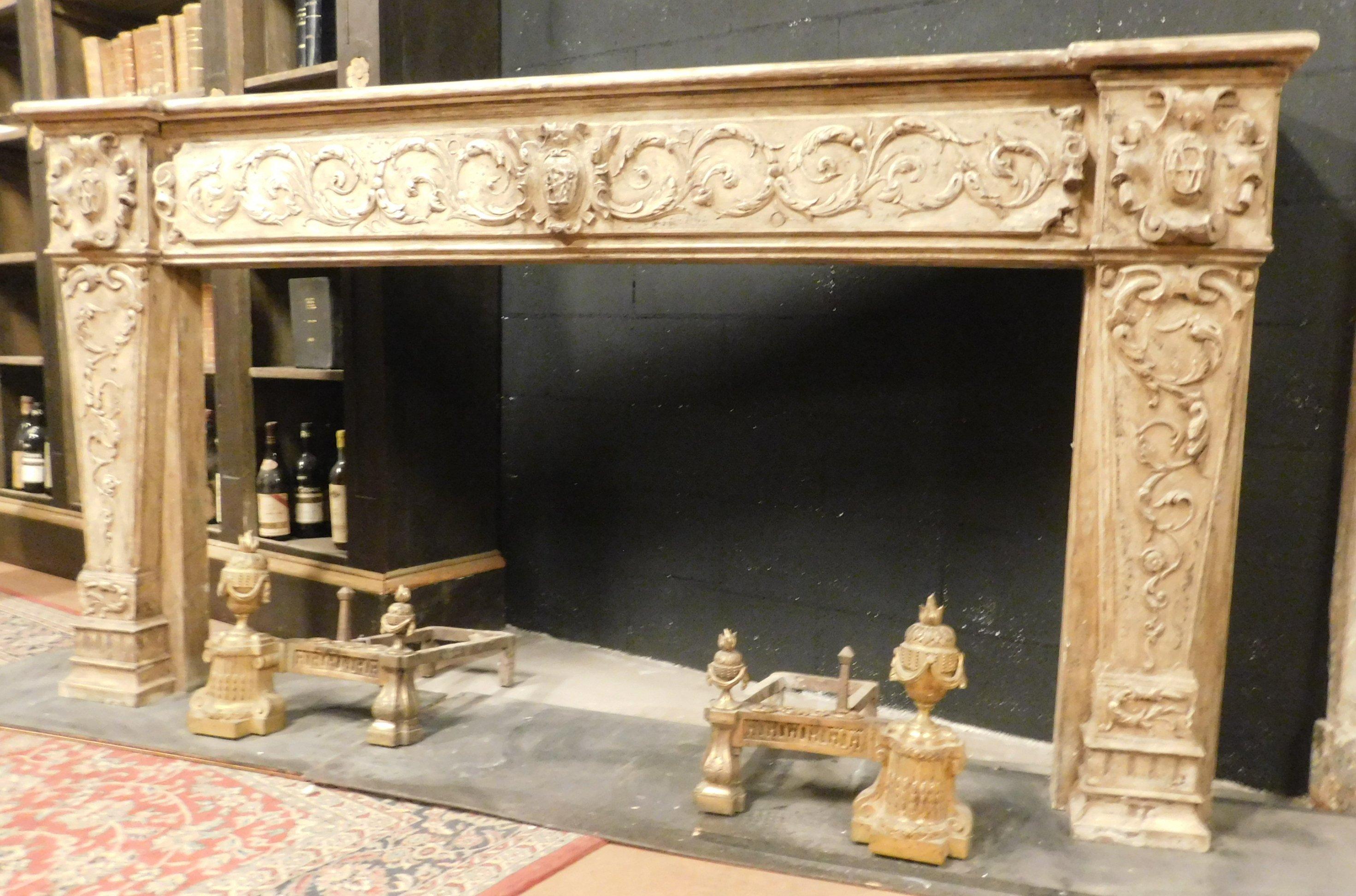 Antique fireplace in beige lacquered wood, very rich and well-defined floral sculptures, coming from an eighteenth-century house in France, elegant and refined, it is possible to lacquer it in another color if one wanted to, suitable for many
