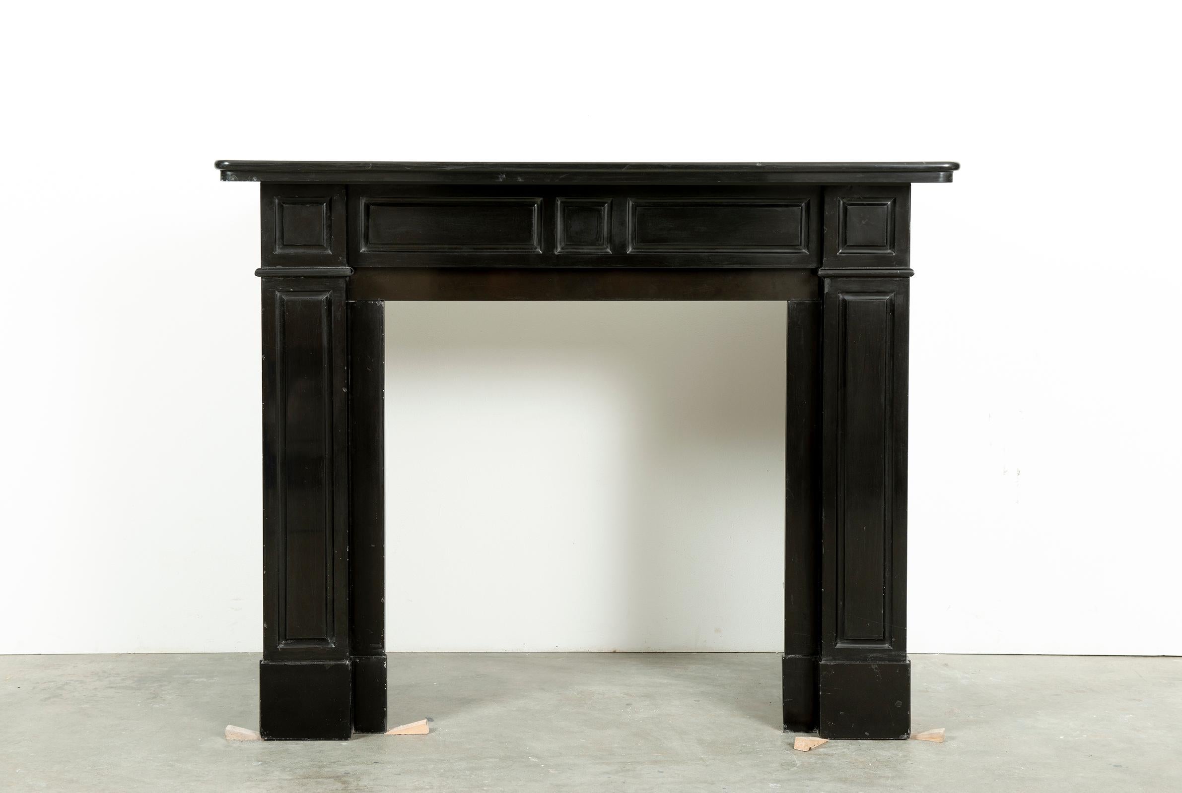 A nice Dutch paneled fireplace in Belgian black marble.
This deep black marble come from the quarry of Mazy.
Made between 1920 and 1970 these mantels where used all over Holland, usually in multi story houses with on each floor two similar