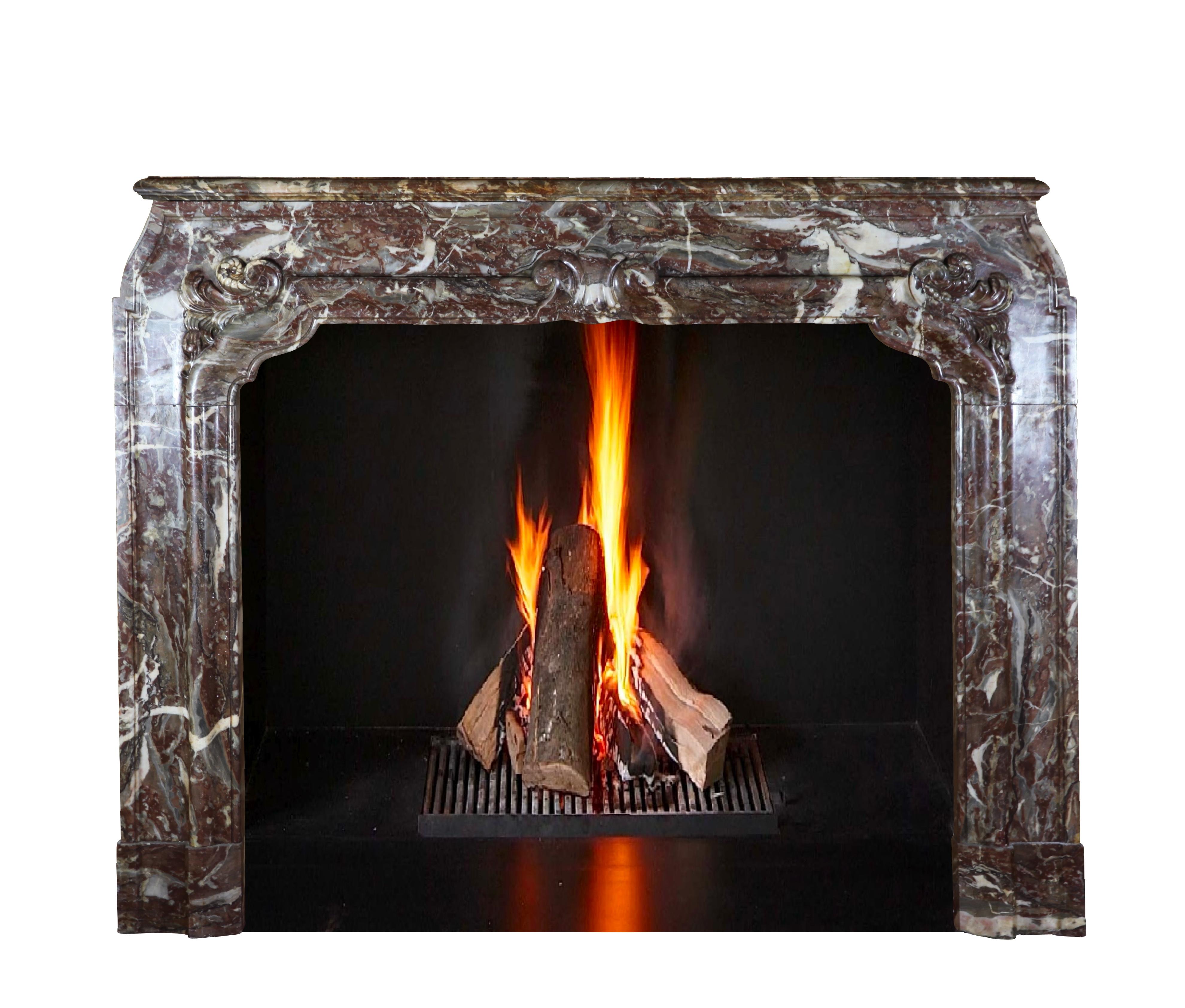 This original Belgian beautiful antique chimney piece in Rochefort Abbey marble (Belgian Trappist Beer) is from the Louis XIV period, 18th century. It was installed in grand home in the city of Antwerp.
This piece is more than just decor. It is