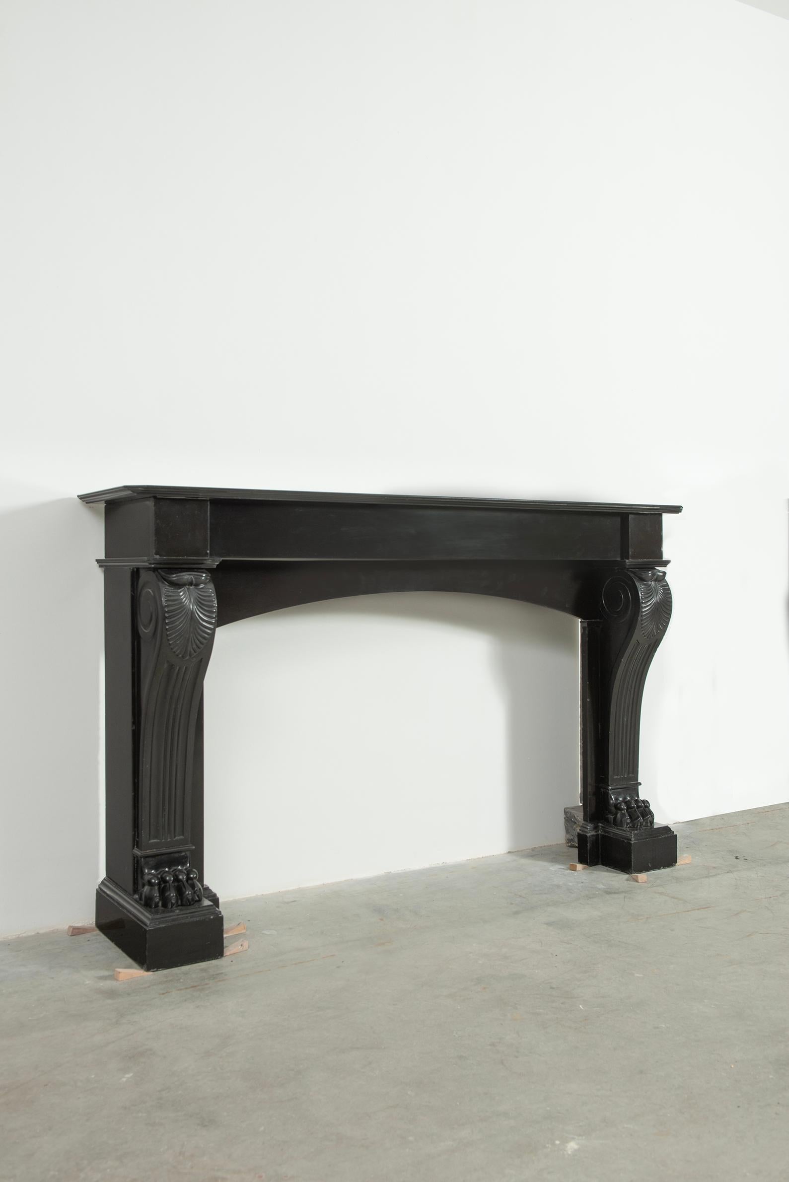 Very happy to offer this French Louis Phillipe fireplace in deep black belgian marble.
This mantel came from the outskirts of Paris.
The overall execution and carving is exceptionally well done, the details in the lion paws, the nails and the leaved