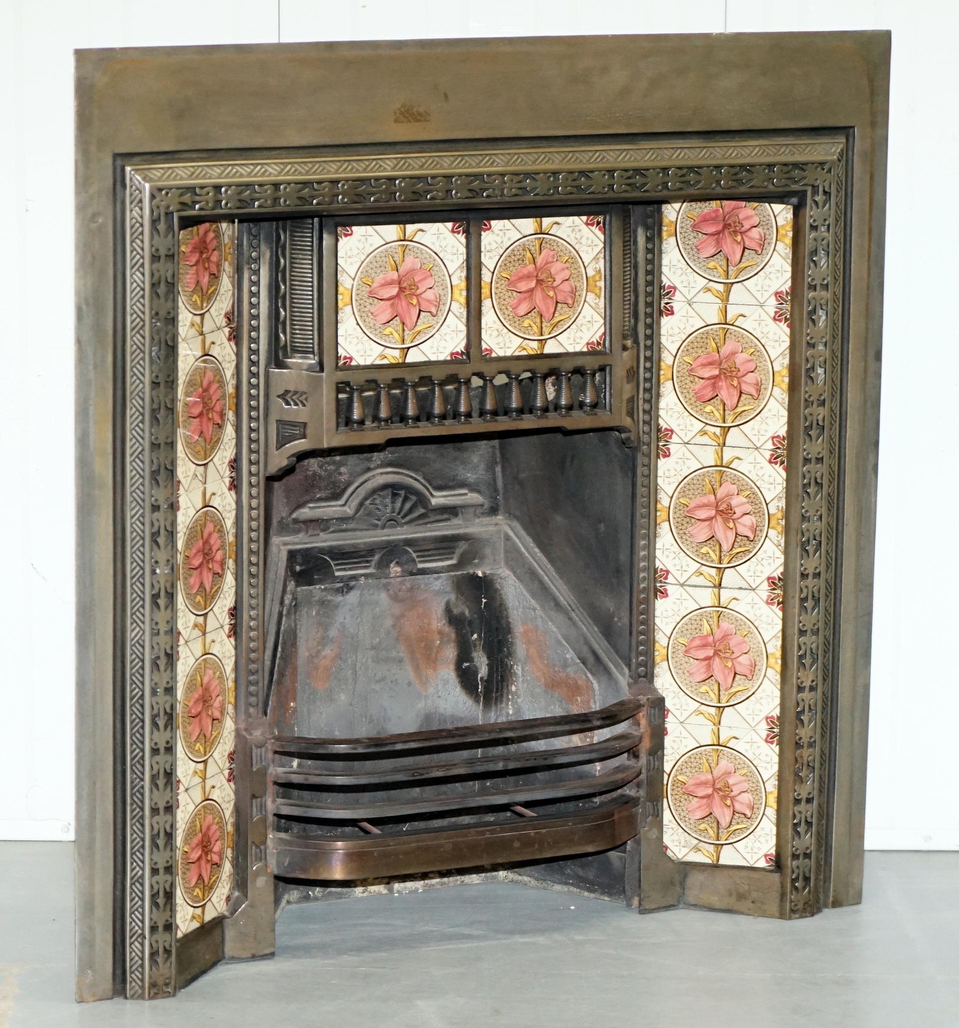 We are delighted to offer for sale this lovely vintage cast iron with silvered finish Fireplace insert complete with hand painted tiles

A very nice Victorian style fireplace insert, it came to me exactly as you see it, a client of mine was