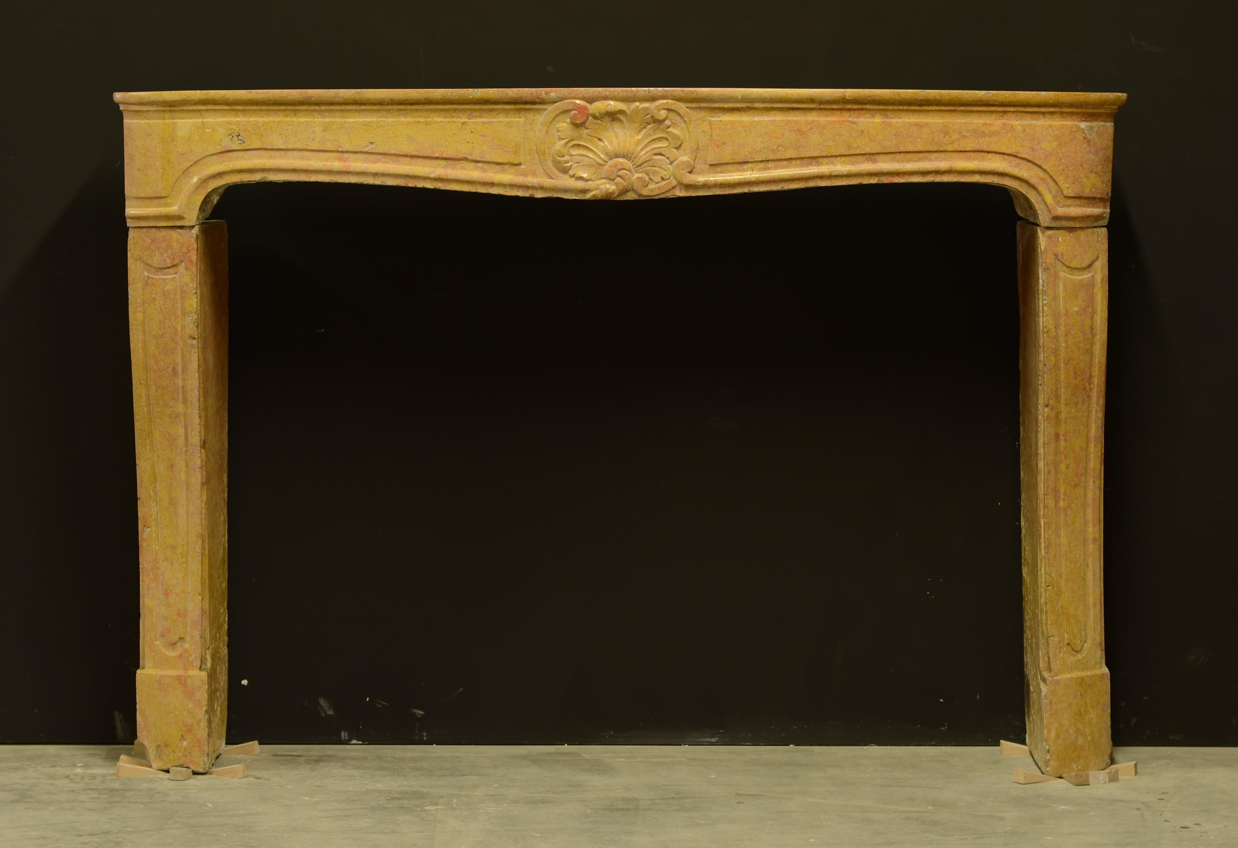 Lovely soft toned yellow limestone with hints of red.

This subtle French mantel dates back to the beginning of the 19th century.

Some minor overall restorations and damages, left corner of the frieze has been extensively restored. Please see