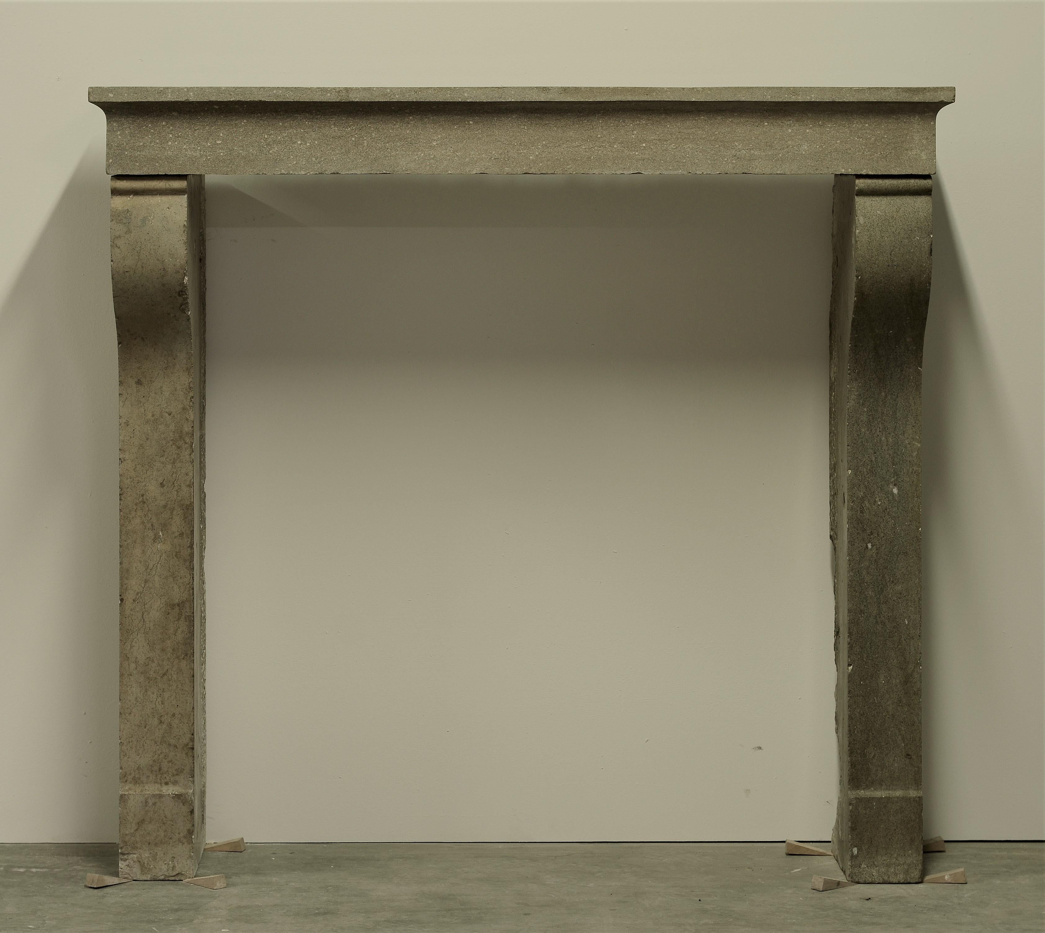 Antique fireplace mantel from the countryside in France, 19th century.
Beautiful well proportioned gray limestone mantelpiece, great condition.

Ready to be shipped and installed.
