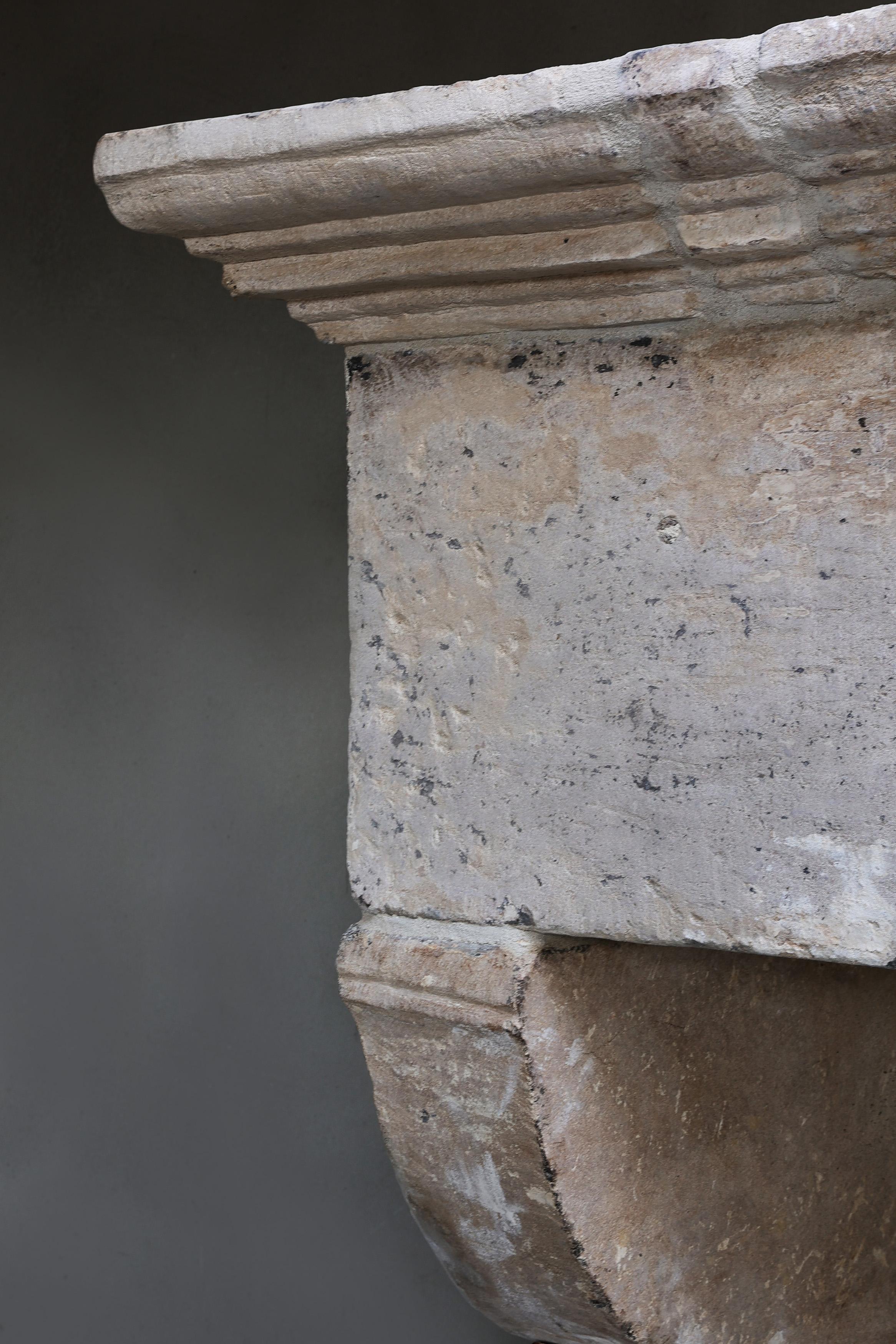 Antique Fireplace Mantel from the 17th century of french limestone For Sale 4