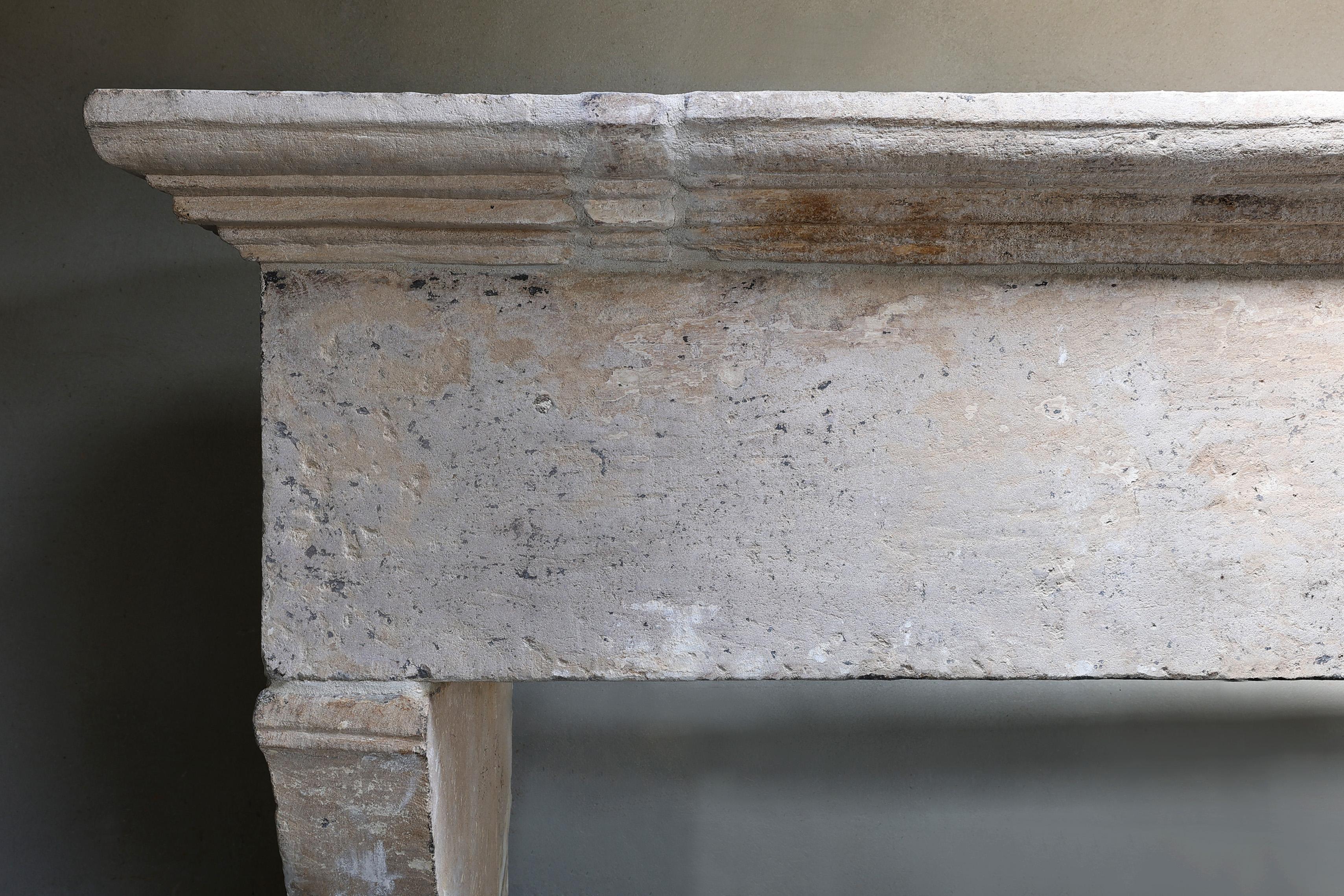 Louis XIII Antique Fireplace Mantel from the 17th century of french limestone For Sale