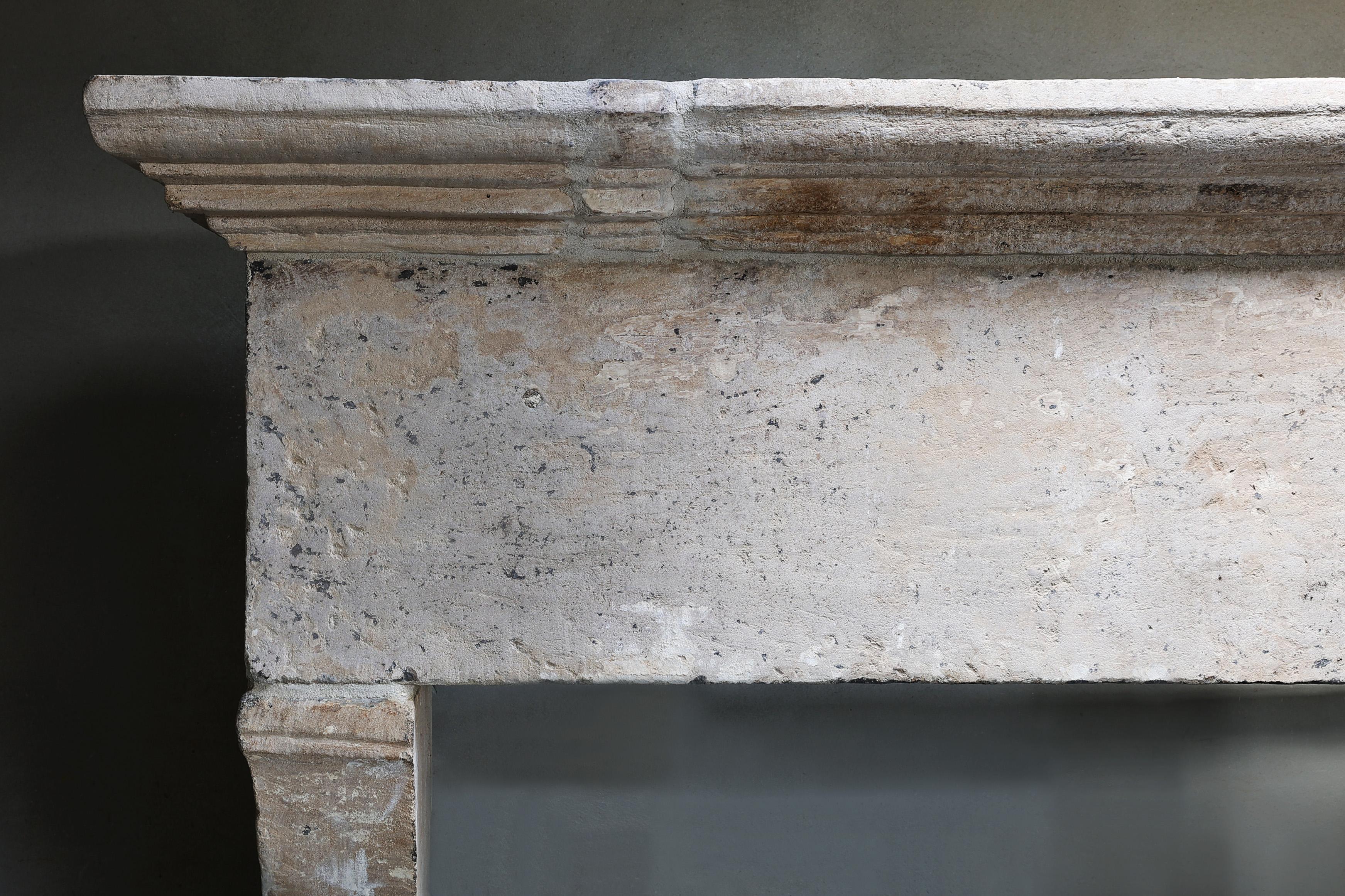 Antique Fireplace Mantel from the 17th century of french limestone In Good Condition For Sale In Made, NL