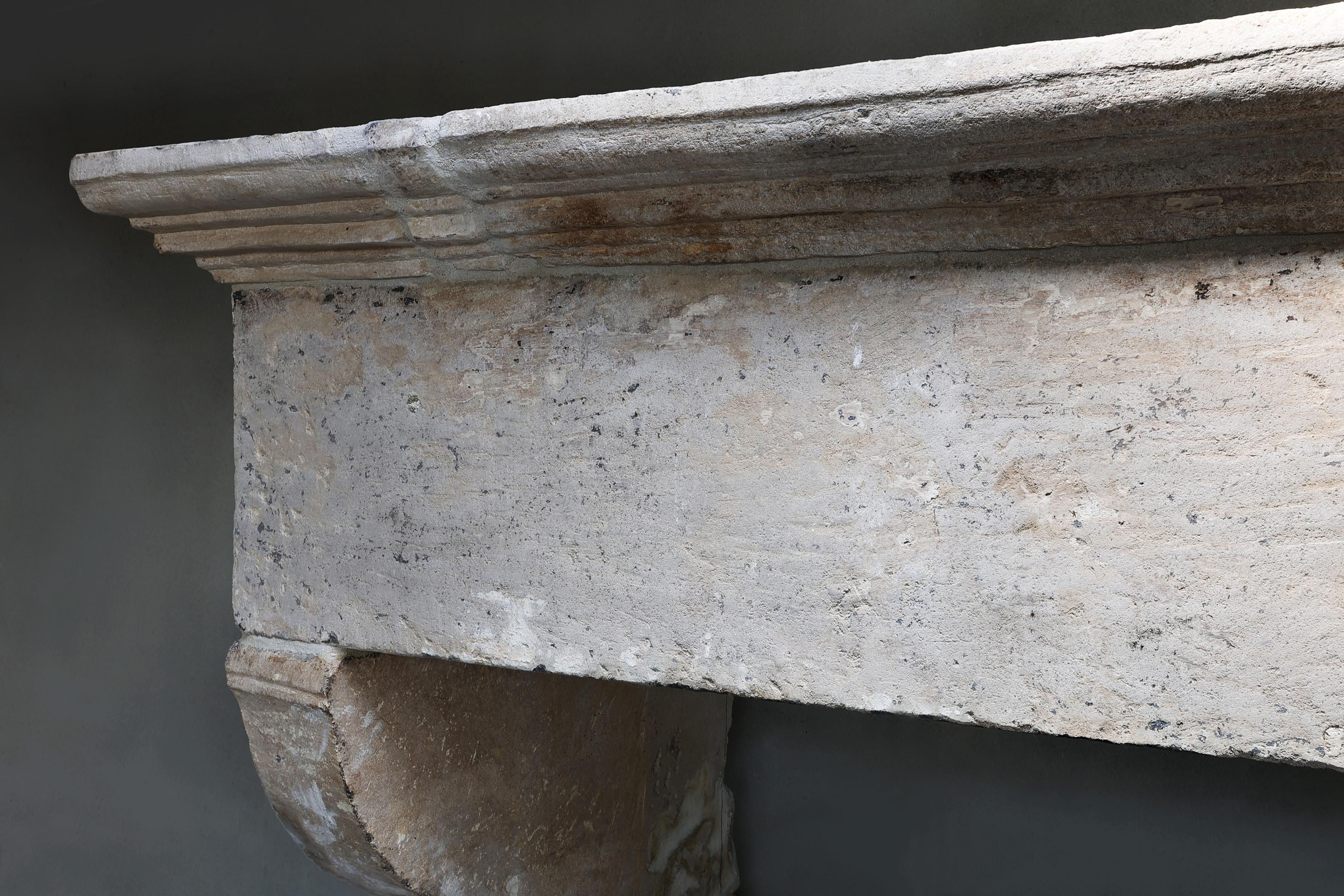 18th Century and Earlier Antique Fireplace Mantel from the 17th century of french limestone For Sale