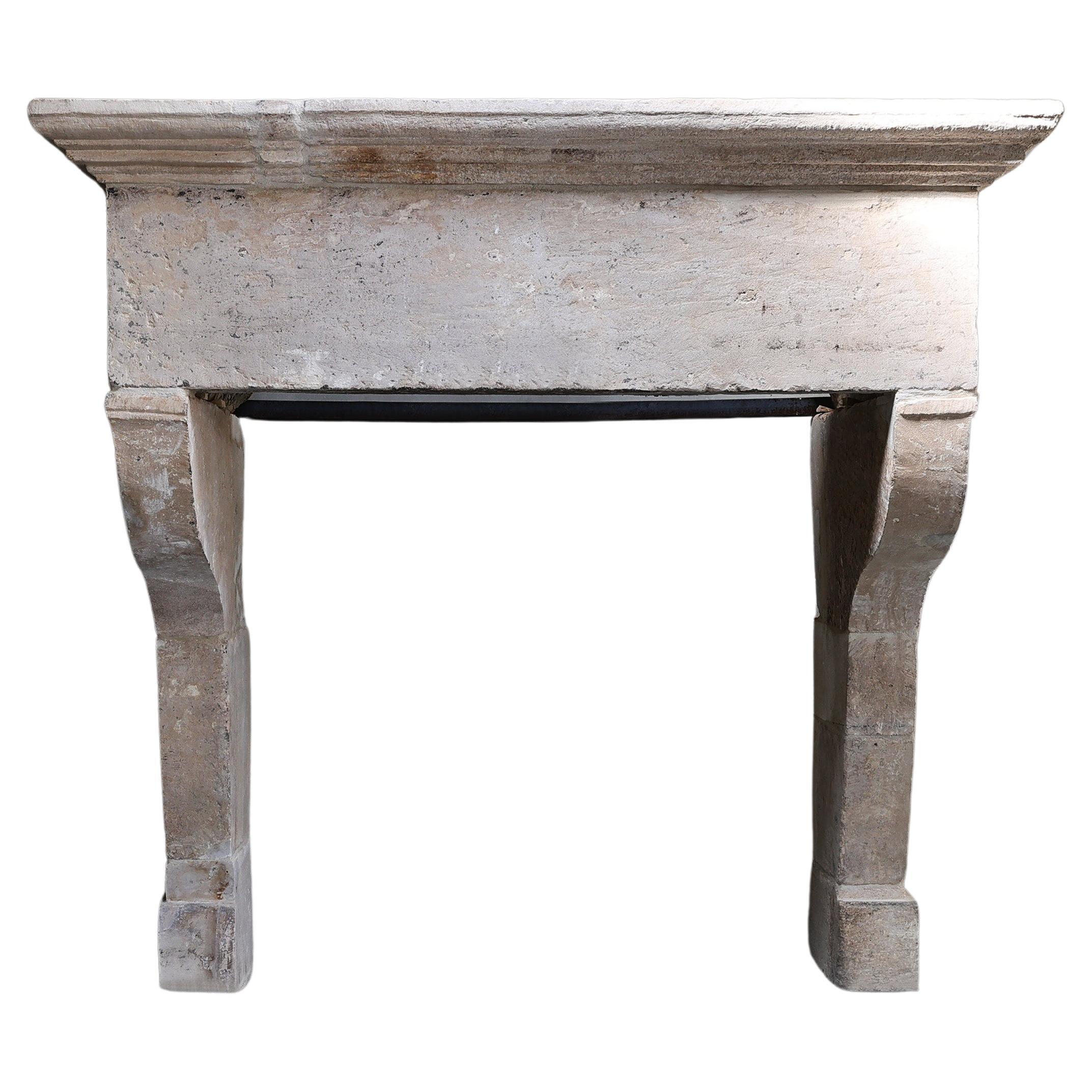 Antique Fireplace Mantel from the 17th century of french limestone For Sale