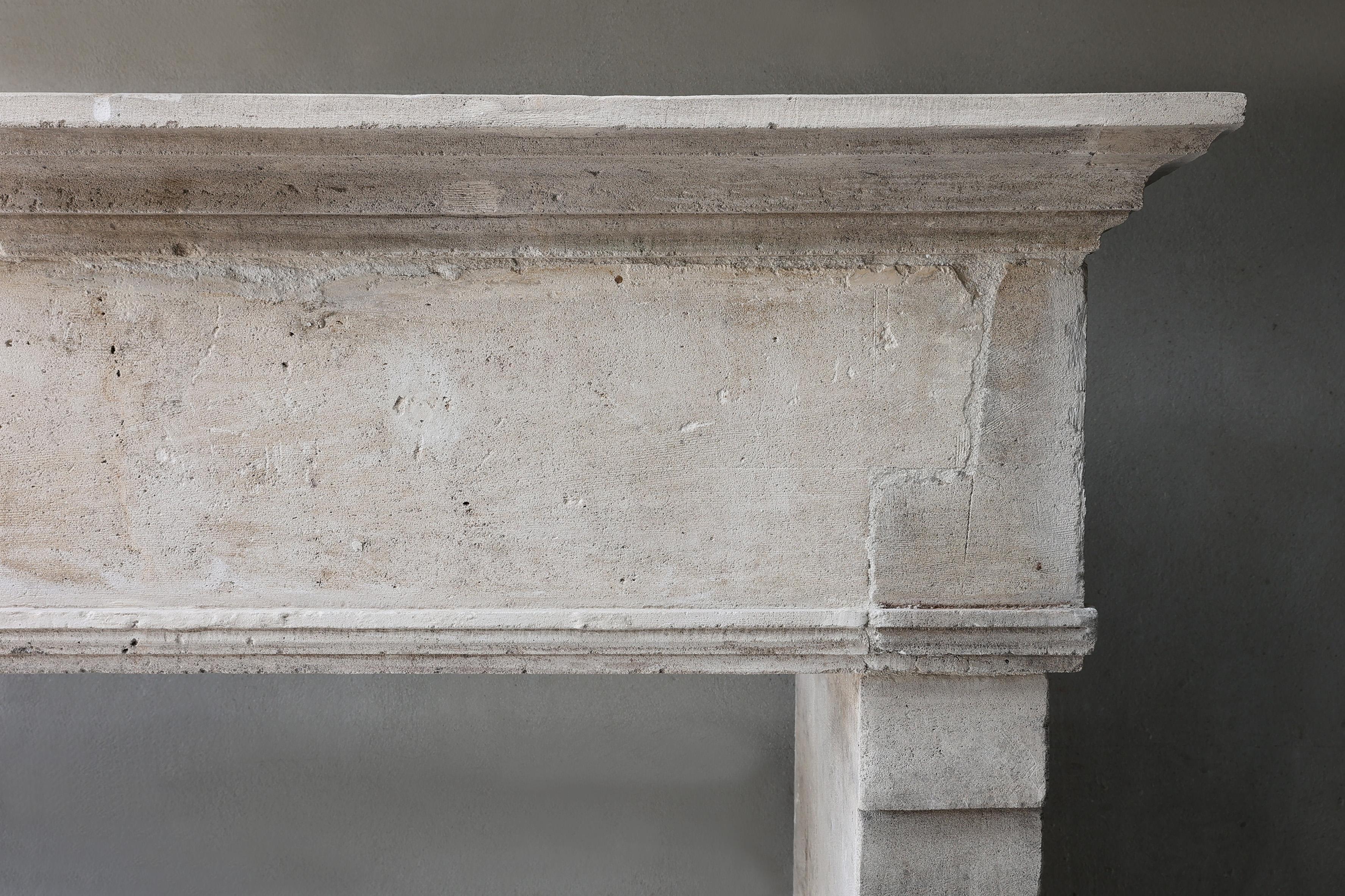 Louis XIII Antique Fireplace Mantel from the 19th century of french limestone For Sale
