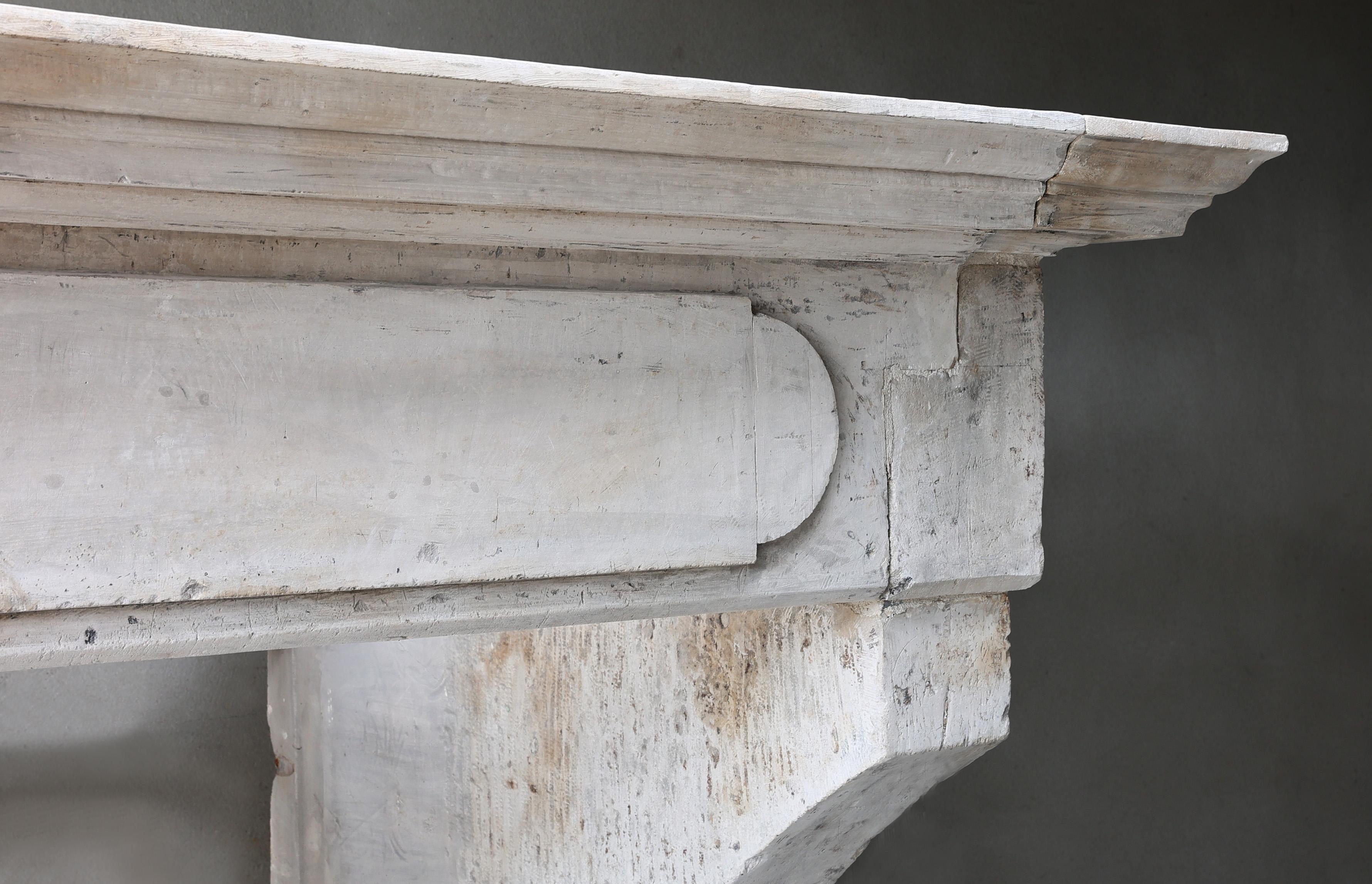 Louis XIII Antique Fireplace Mantel from the 19th century of french limestone  For Sale