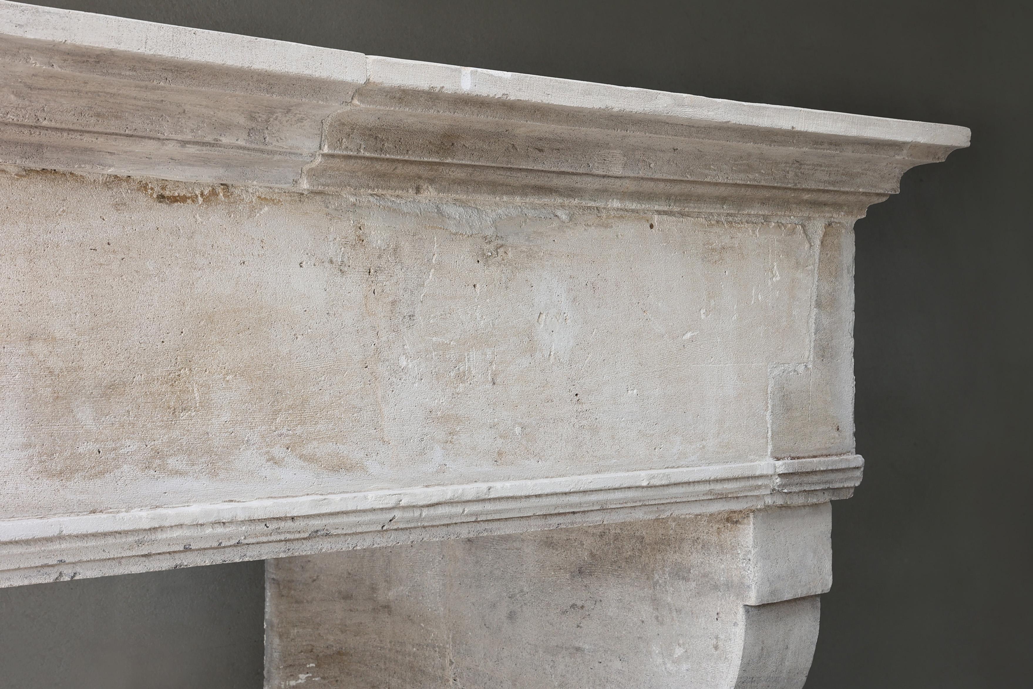 French Antique Fireplace Mantel from the 19th century of french limestone For Sale