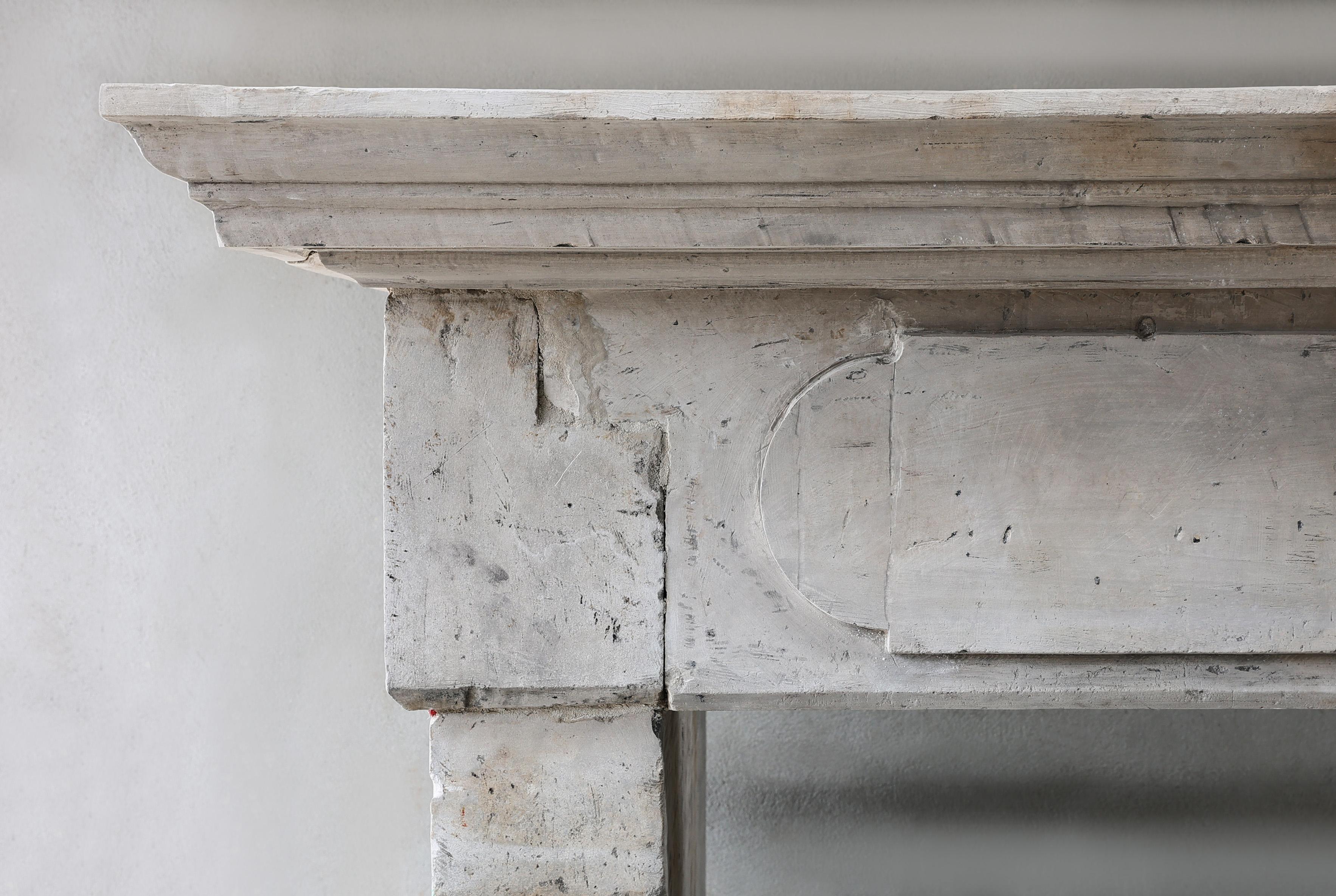 French Antique Fireplace Mantel from the 19th century of french limestone  For Sale