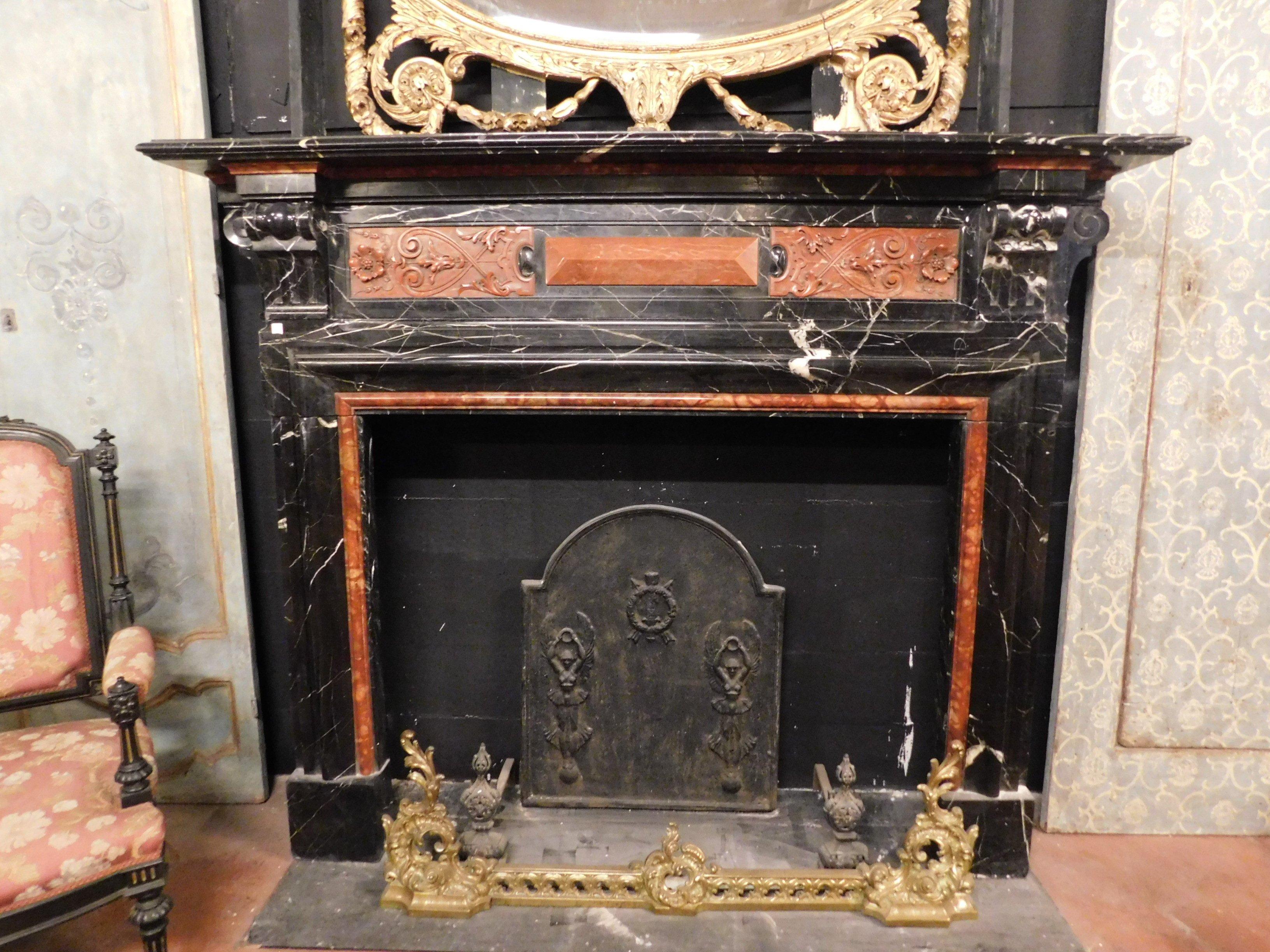 Antique and very precious fireplace in black marble with white veins, inlaid with red marble, hand carved and inlaid in the mid-19th century, by a Belgian craftsman artist, for a historic Belgian building.
Great luxury and elegance, black gives the