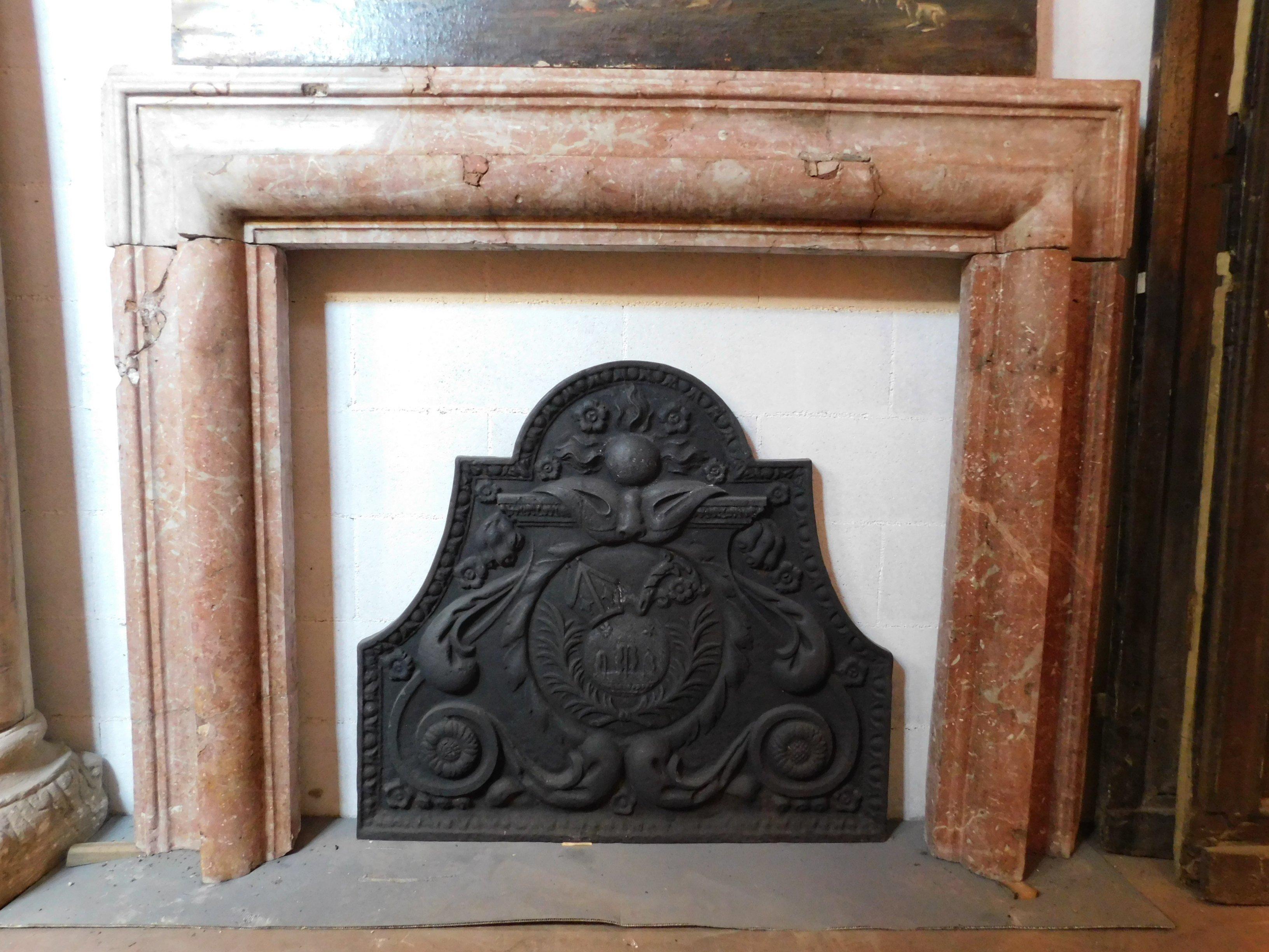 Antique mantel fireplace, hand-carved with a geometric shape called Salvator Rosa in red 