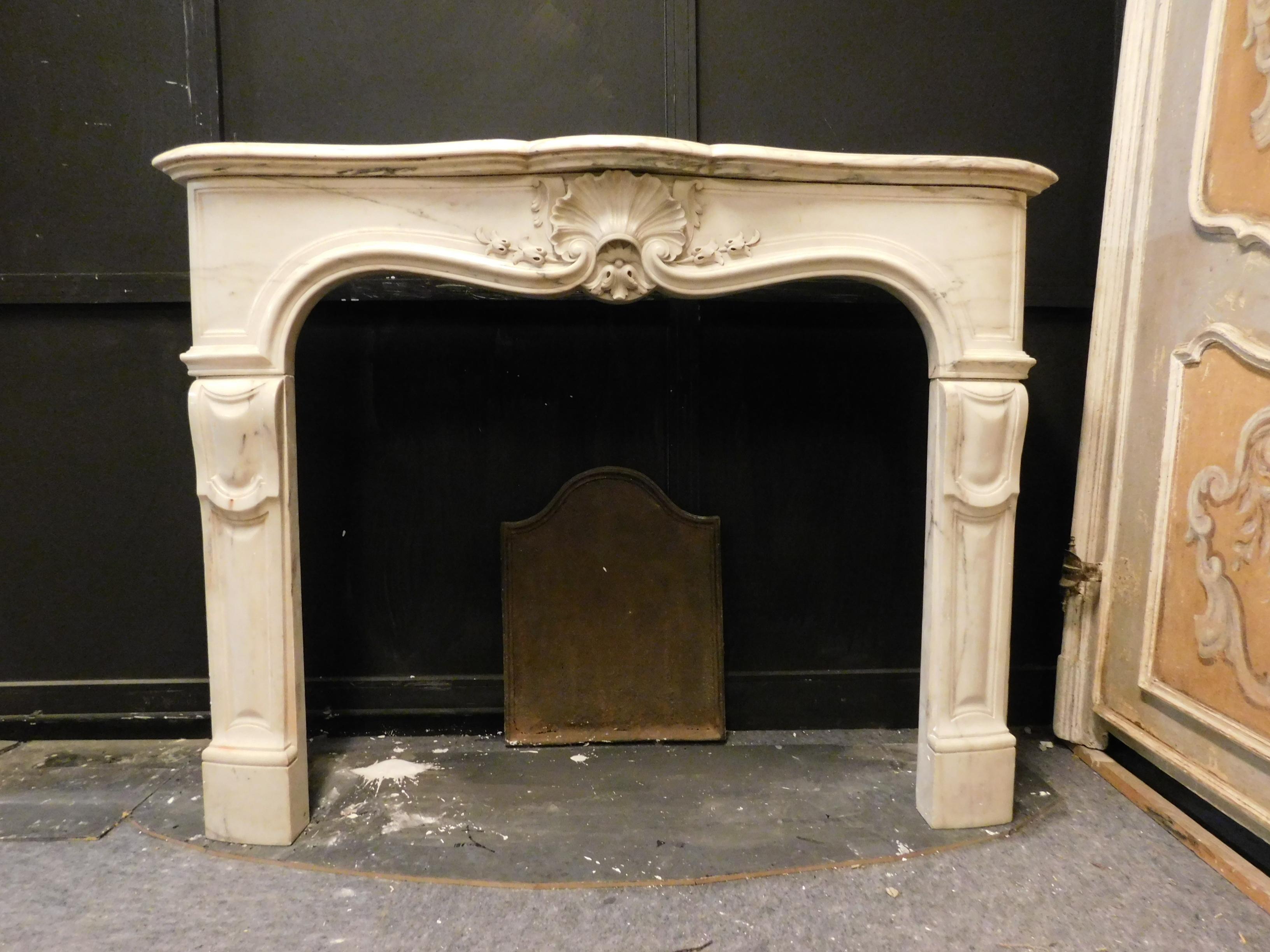 Antique and elegant mantel fireplace, hand-carved in white Carrara marble, with Louis XV style, built and hand-sculpted in the first half of the 18th century, from a noble palace in France, maximum external size cm W 147 x H 111 x T 44, internal