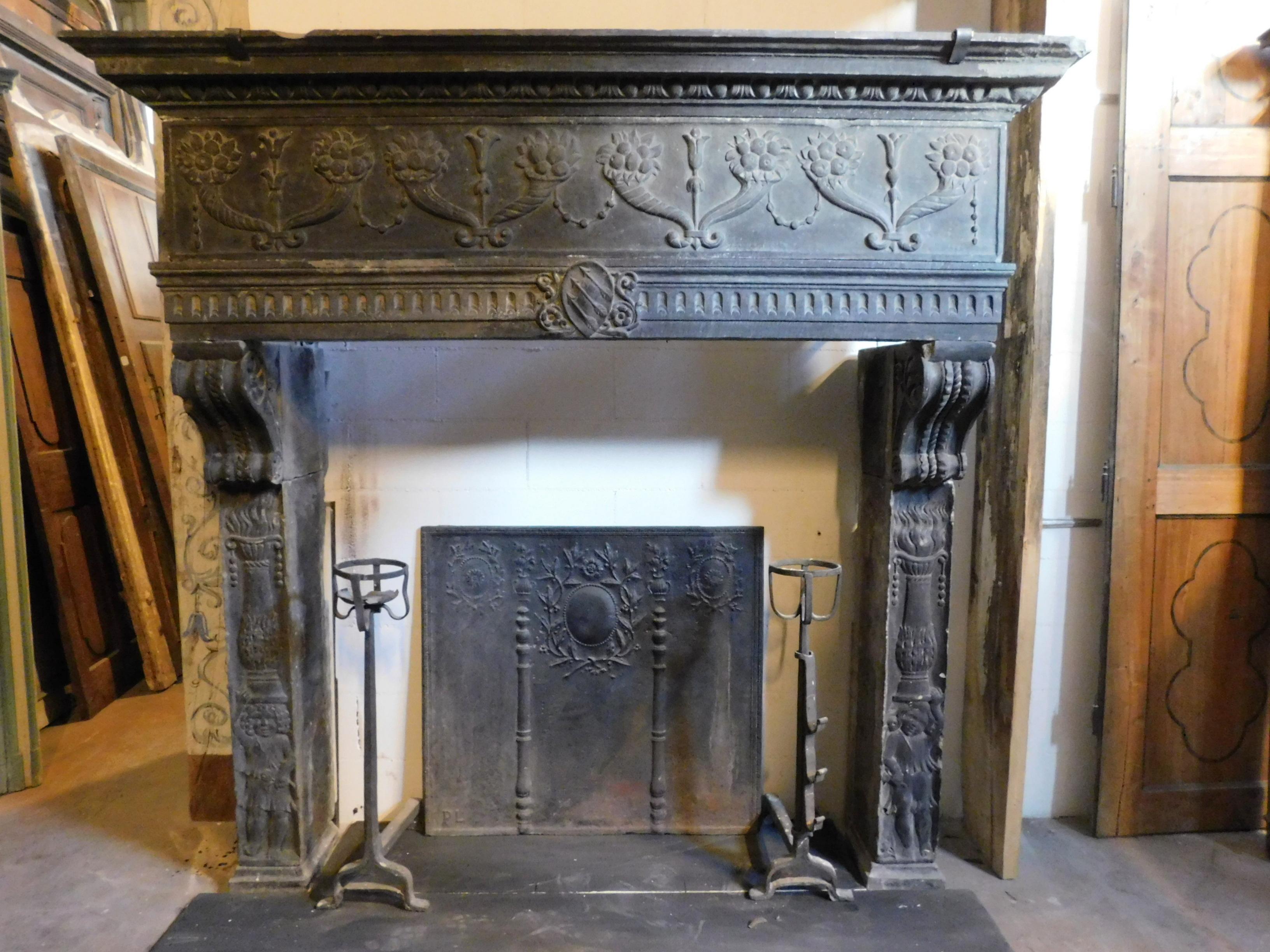 Antique mantel fireplace, in slate stone, richly hand-carved with cprnucopie and classic decorations of the time, original from the 16th century, built and sculpted entirely by hand by fine craftsmen for important buildings in Italy, precisely La