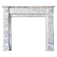 Antique fireplace of Arabescato in style of Louis XVI from the 19th century