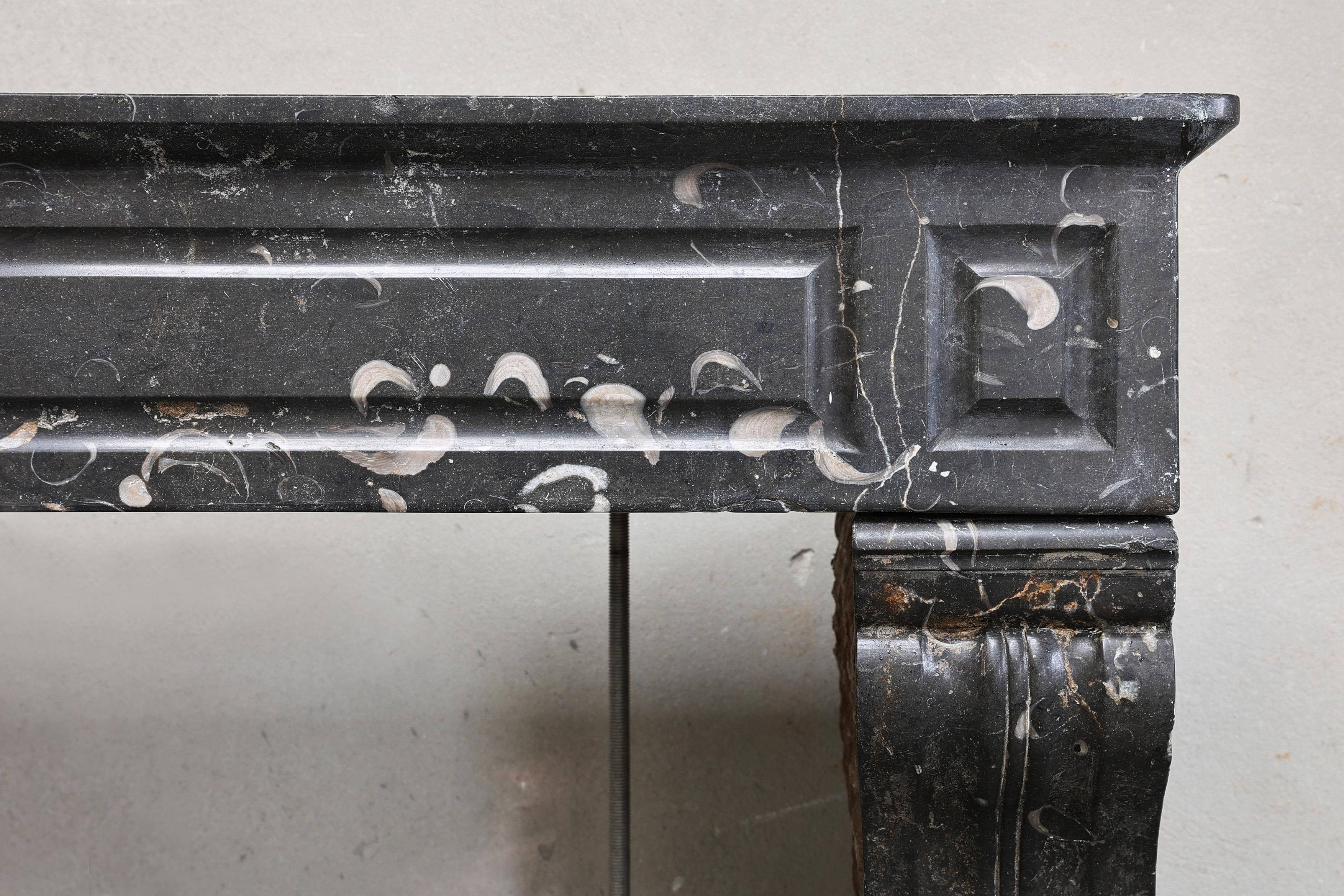 Other Antique fireplace of black marble with white veins from the 19th century For Sale
