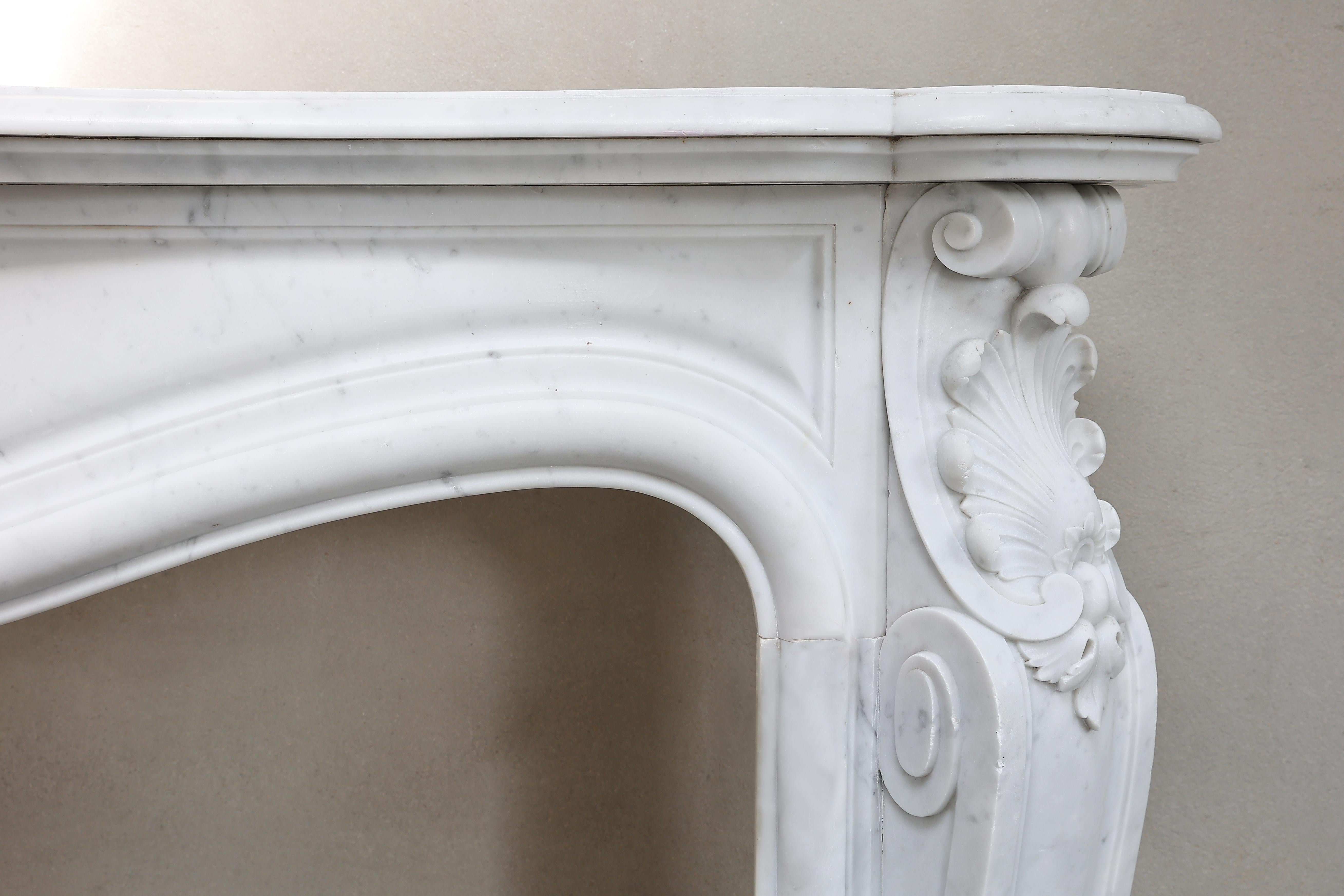 French Antique Fireplace of Carrara Marble in Style of Louis XV from the 19th Century For Sale