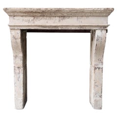 Antique fireplace of french limestone in style of Campagnarde