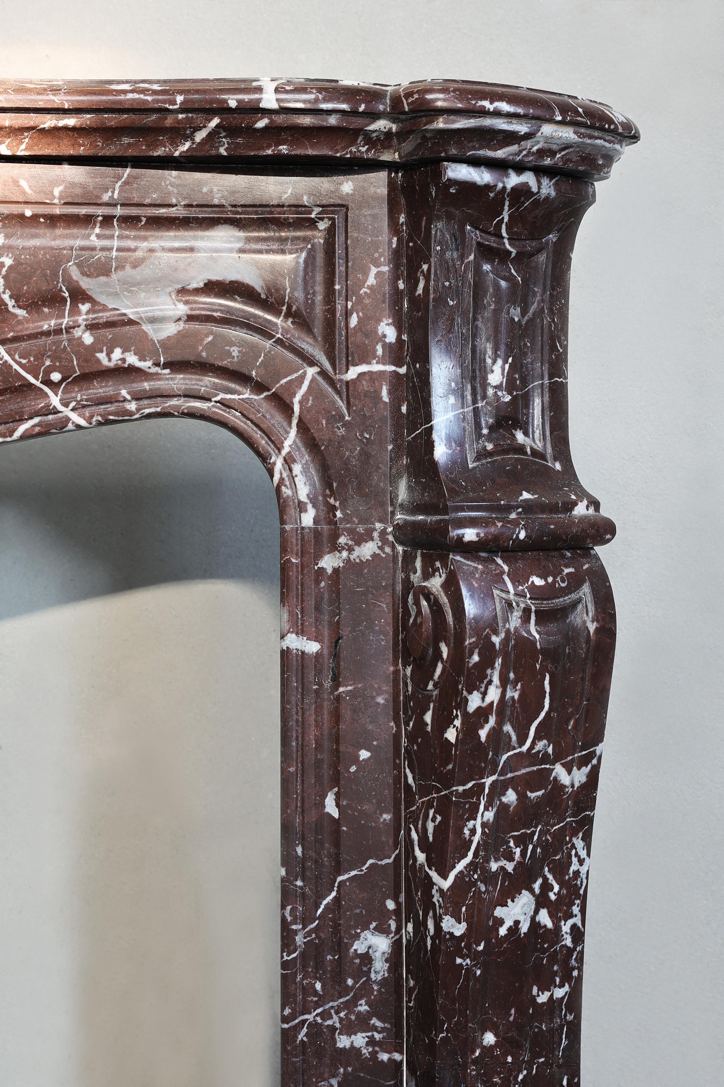 Marble Antique fireplace of Griotte Rouge marble form the 19th century For Sale