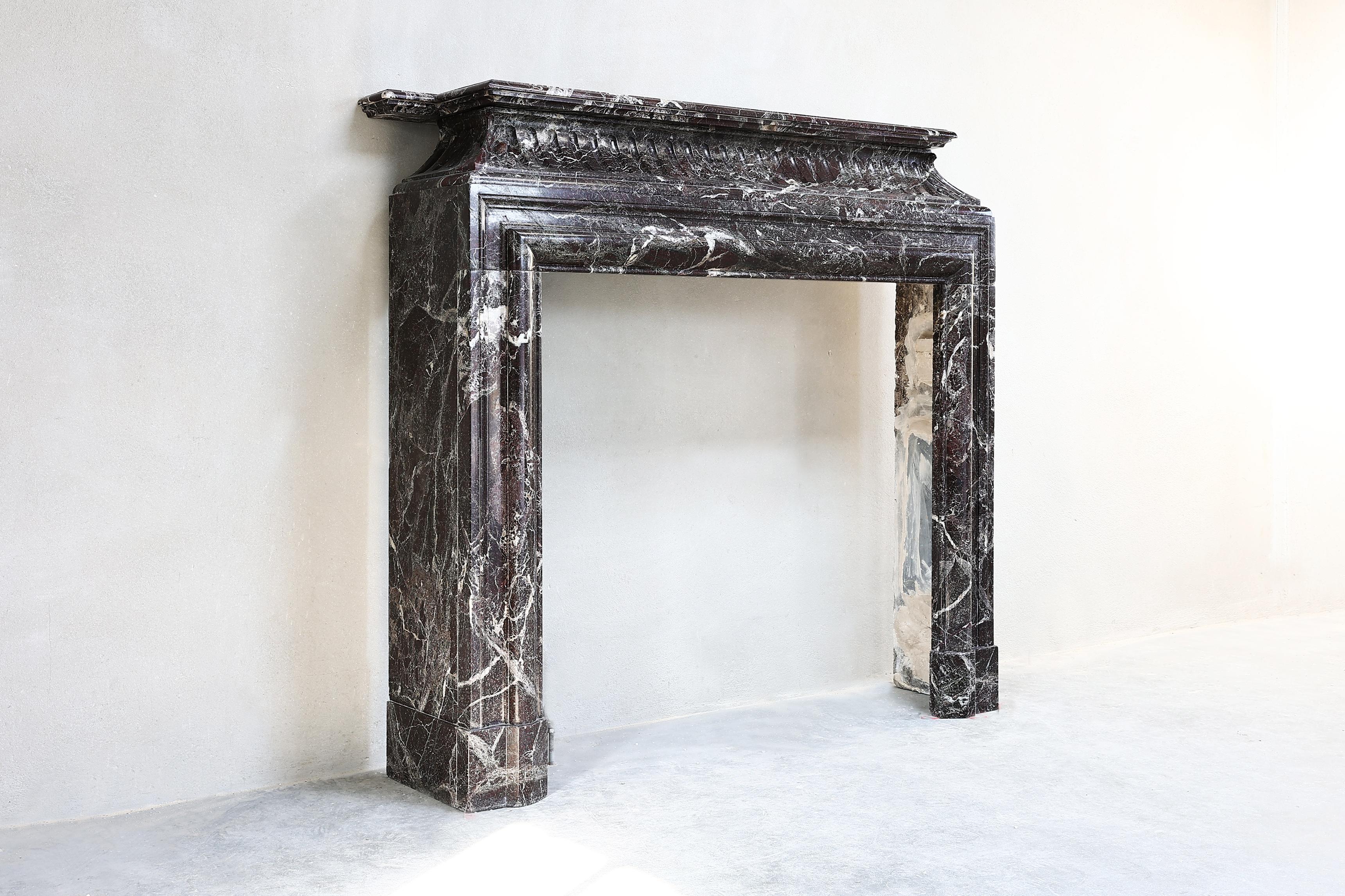 Special antique fireplace of Levanto marble from Italy. This fireplace dates from the 19th century and is in the style of Louis XVI. This fireplace has beautiful flutes in the front part and straight legs. The color of this fireplace gives a warm