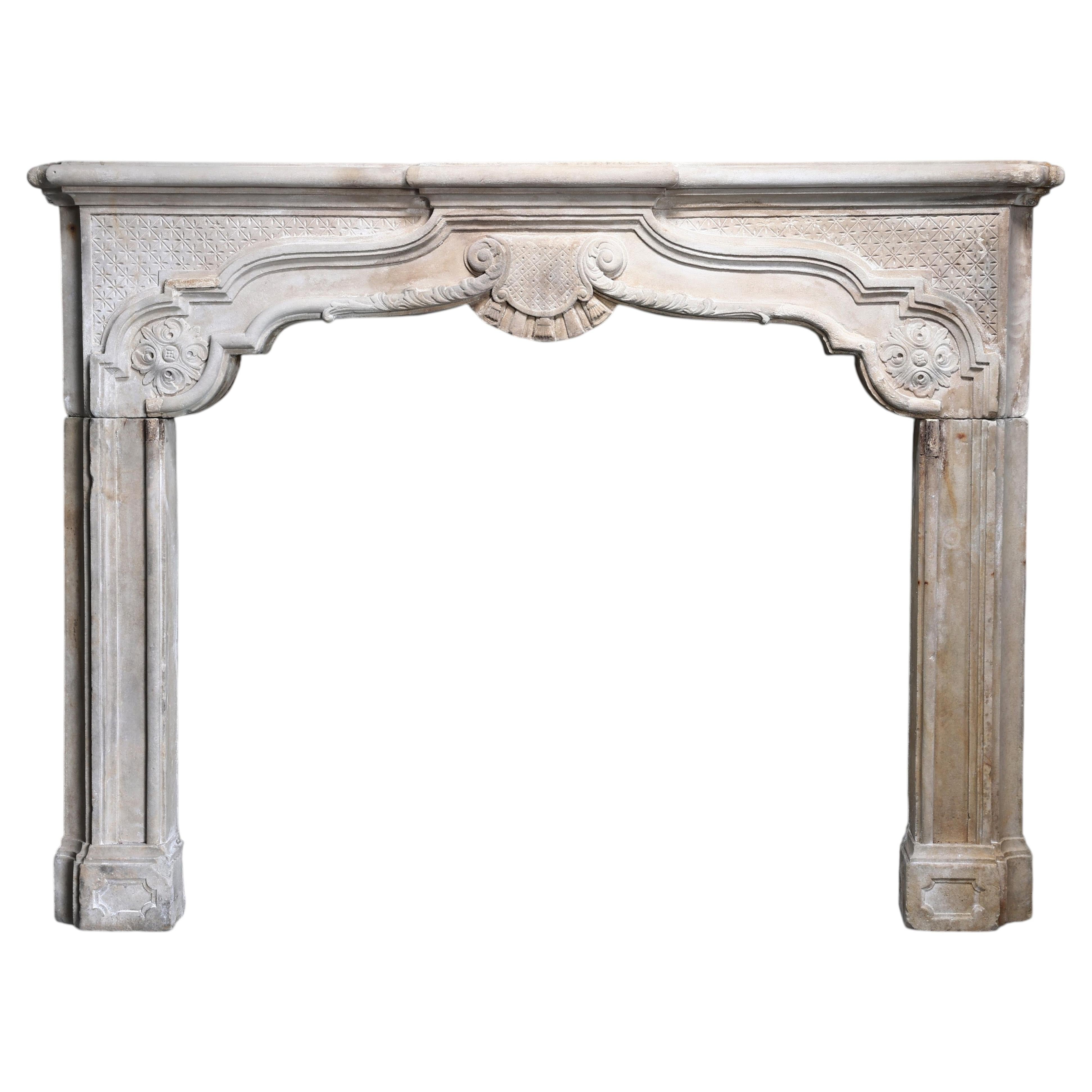 Antique fireplace of limestone