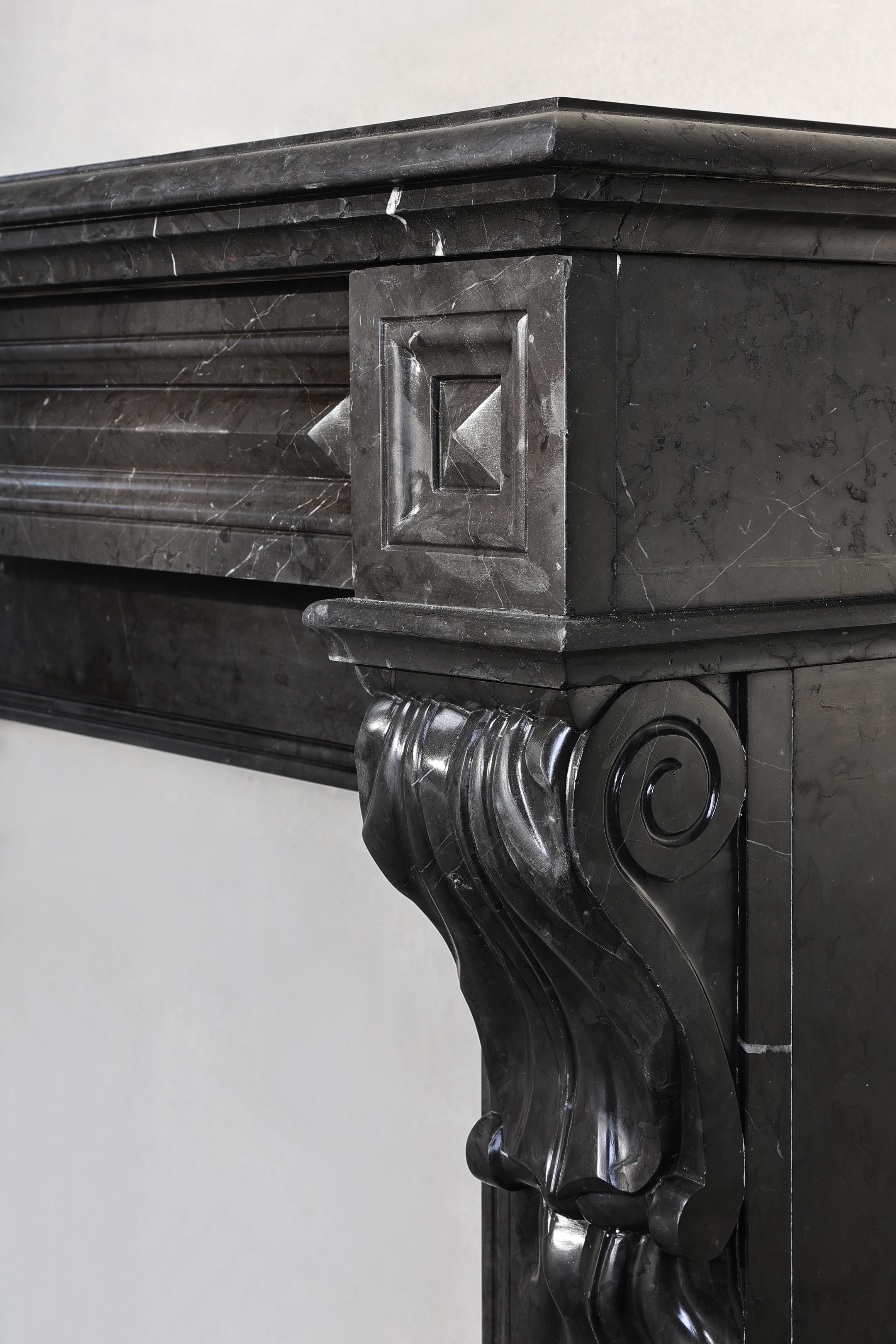 Marble antique fireplace of Nero Marquina marble in style of Louis XVI For Sale