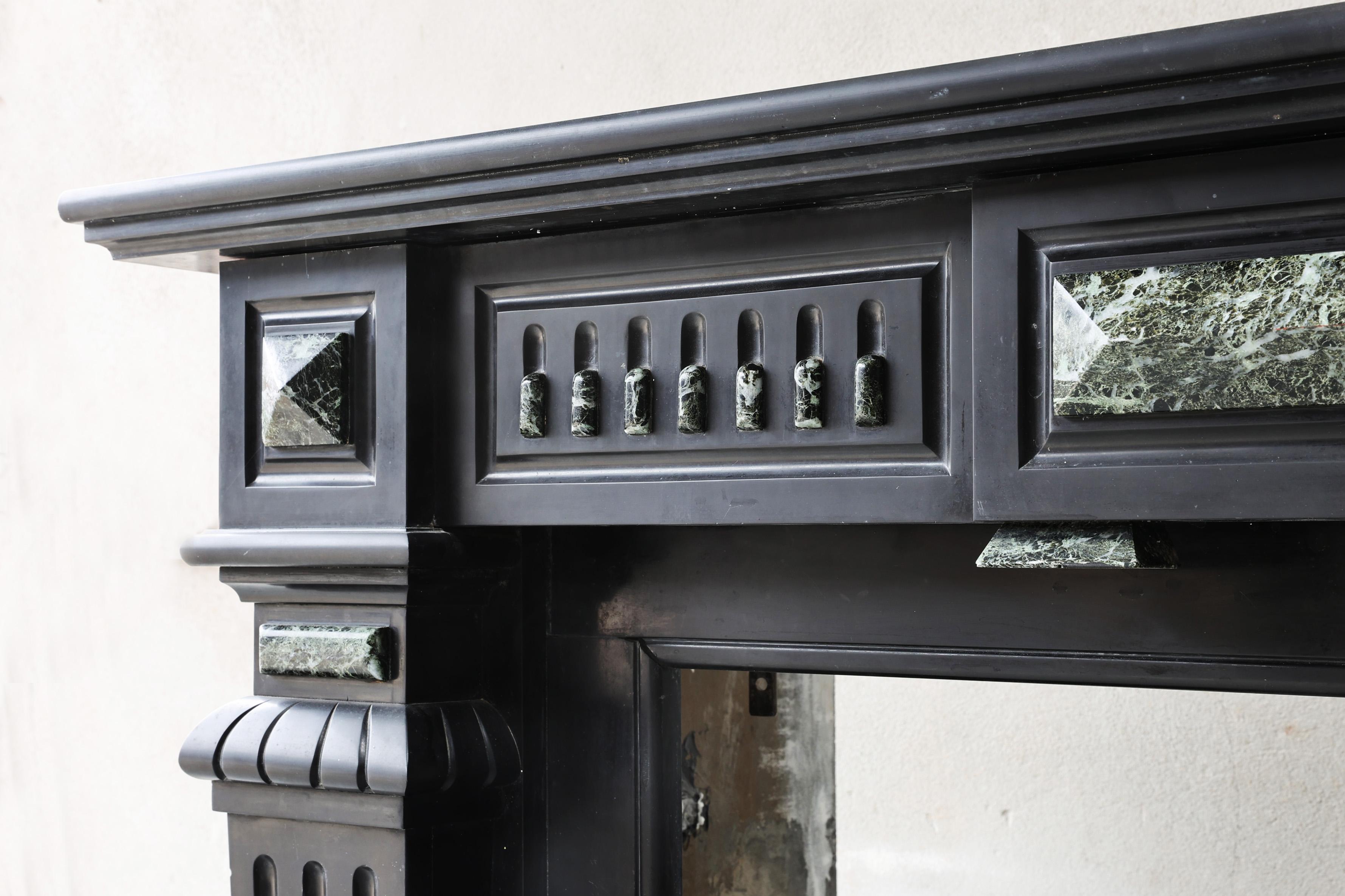 Marble Antique fireplace of Noir de Mazy marble, 19th century, Louis XVI style For Sale