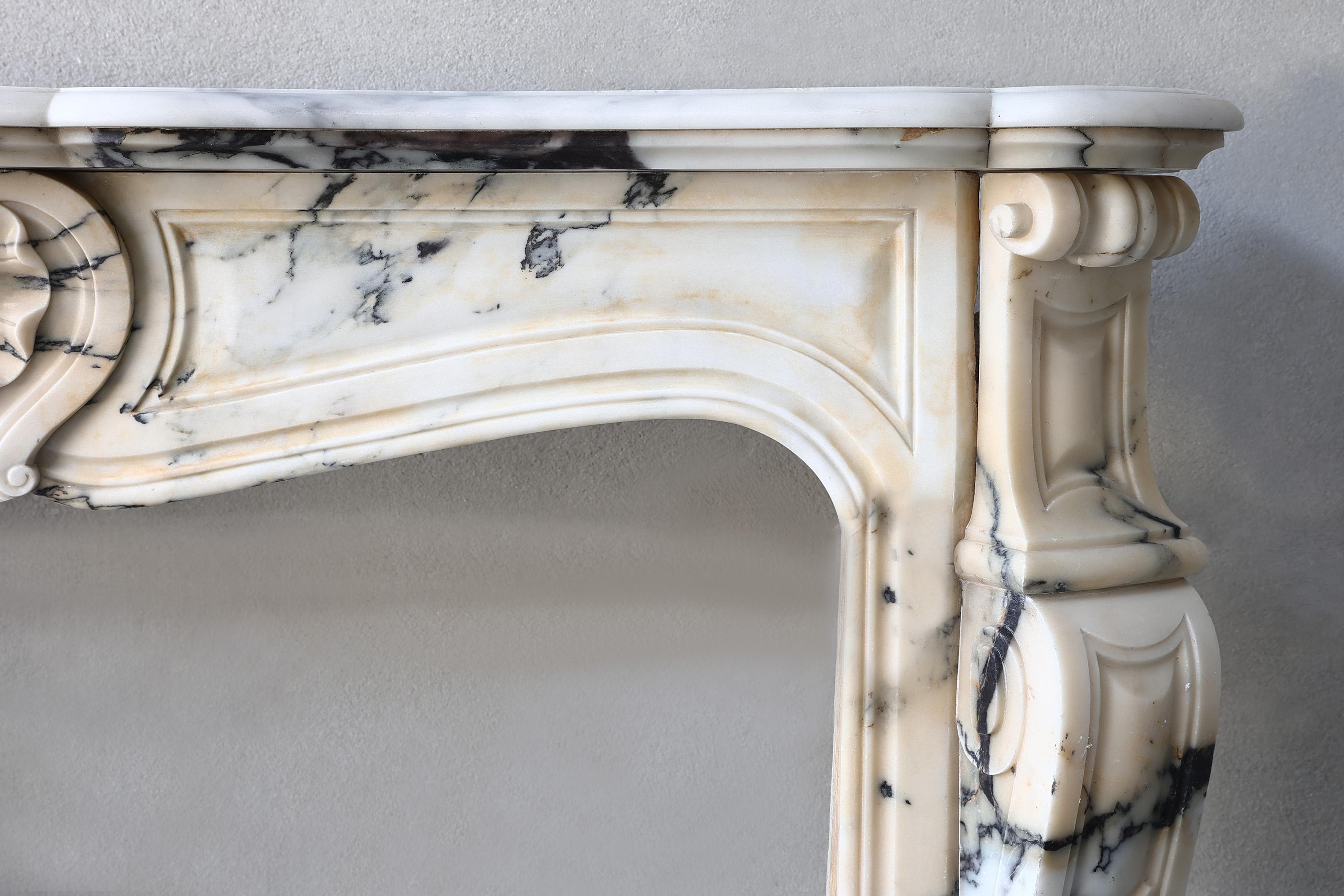 French Antique fireplace of paonazzo marble, 19th century, Louis XV style