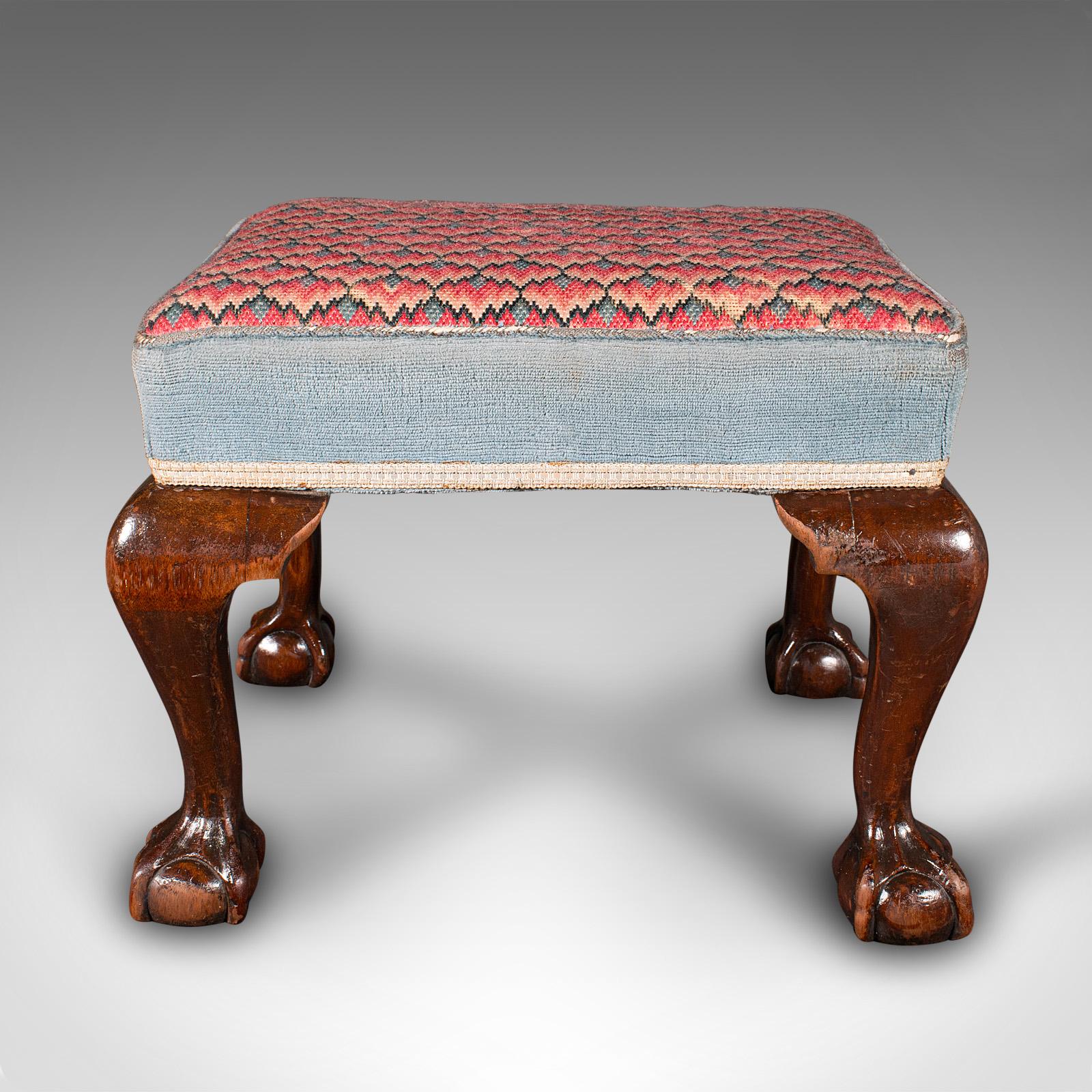 This is an antique fireside stool. An English, mahogany and needlepoint footstool, dating to the early Victorian period, circa 1850.

Cheerful needlepoint cushion over a prominent base
Displays a desirable aged patina and in good order
Select stocks