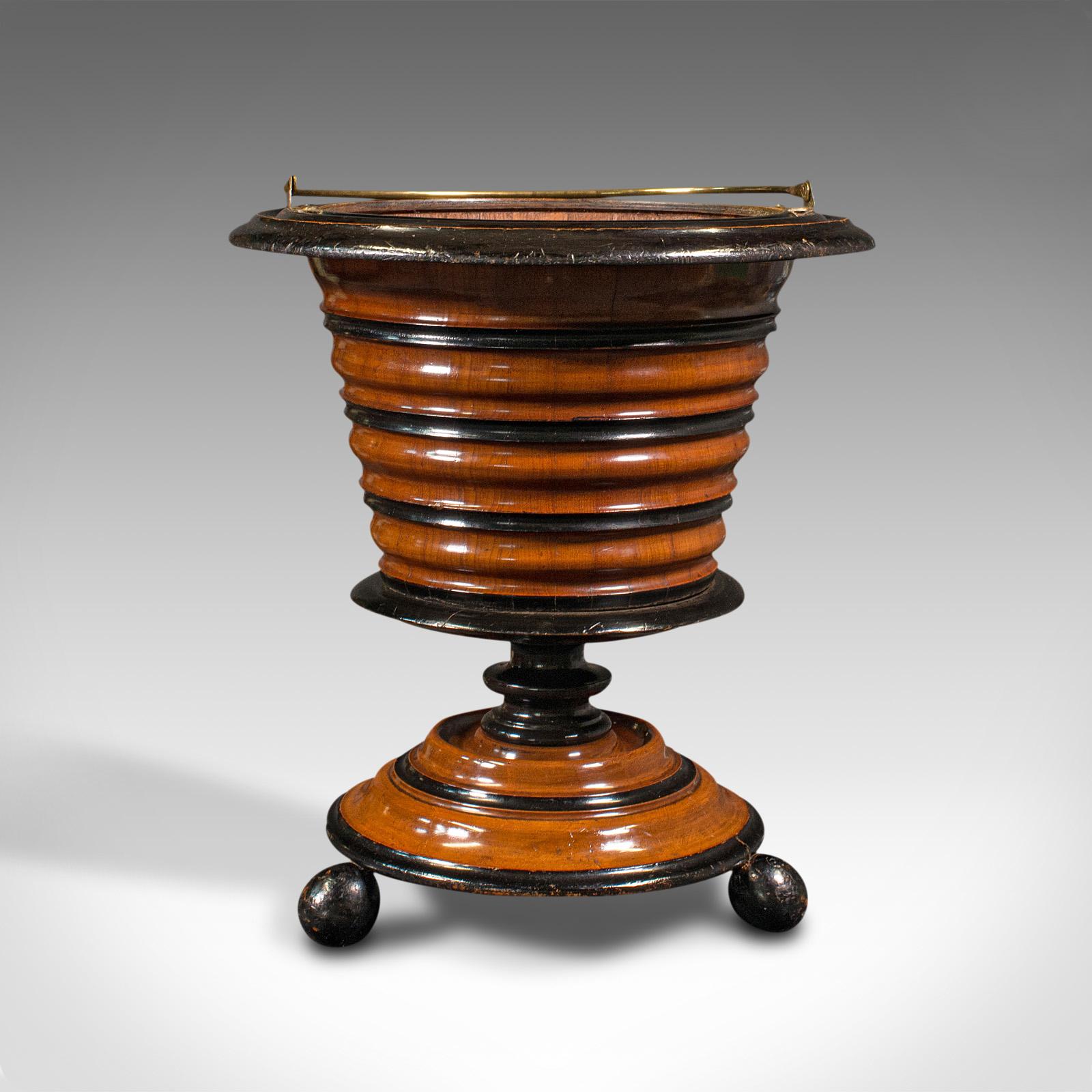 This is an antique fireside store. A Dutch, walnut decorative jardiniere or log bin, dating to the late Victorian period, circa 1900.

Captivating form and colour - a treat for the fireside
Displays a desirable aged patina throughout
Select