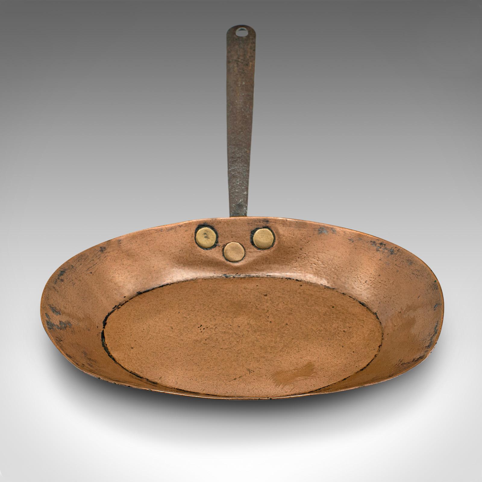 This is an antique fireside warming pan. An English, copper and iron decorative piece, dating to the early Georgian period, circa 1750.

Whilst used in period, the unlined nature of this copper pan is suitable for display use only.

Wonderful