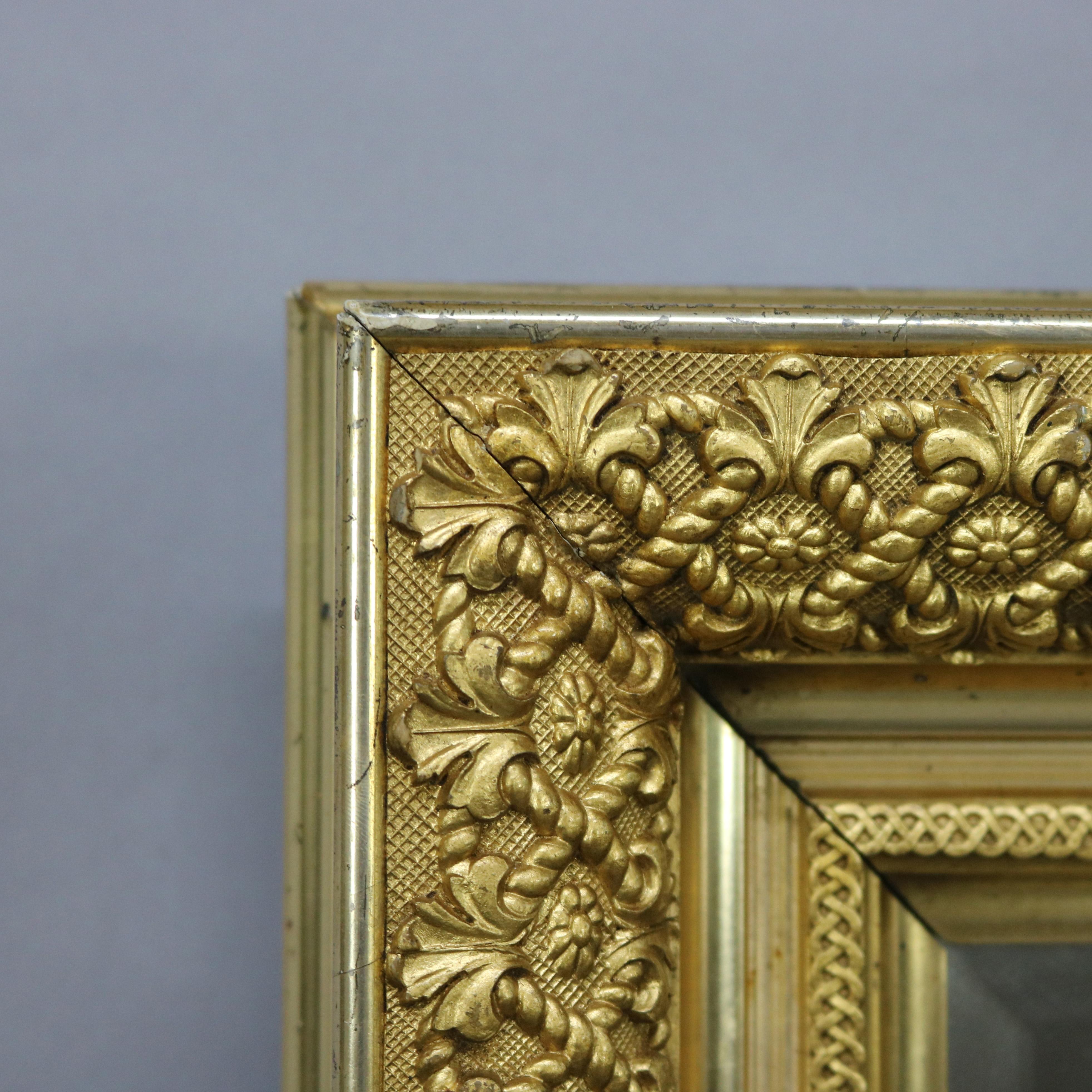 An antique wall mirror offers first finish giltwood construction with foliate decoration, c1890

Measures: 26.5