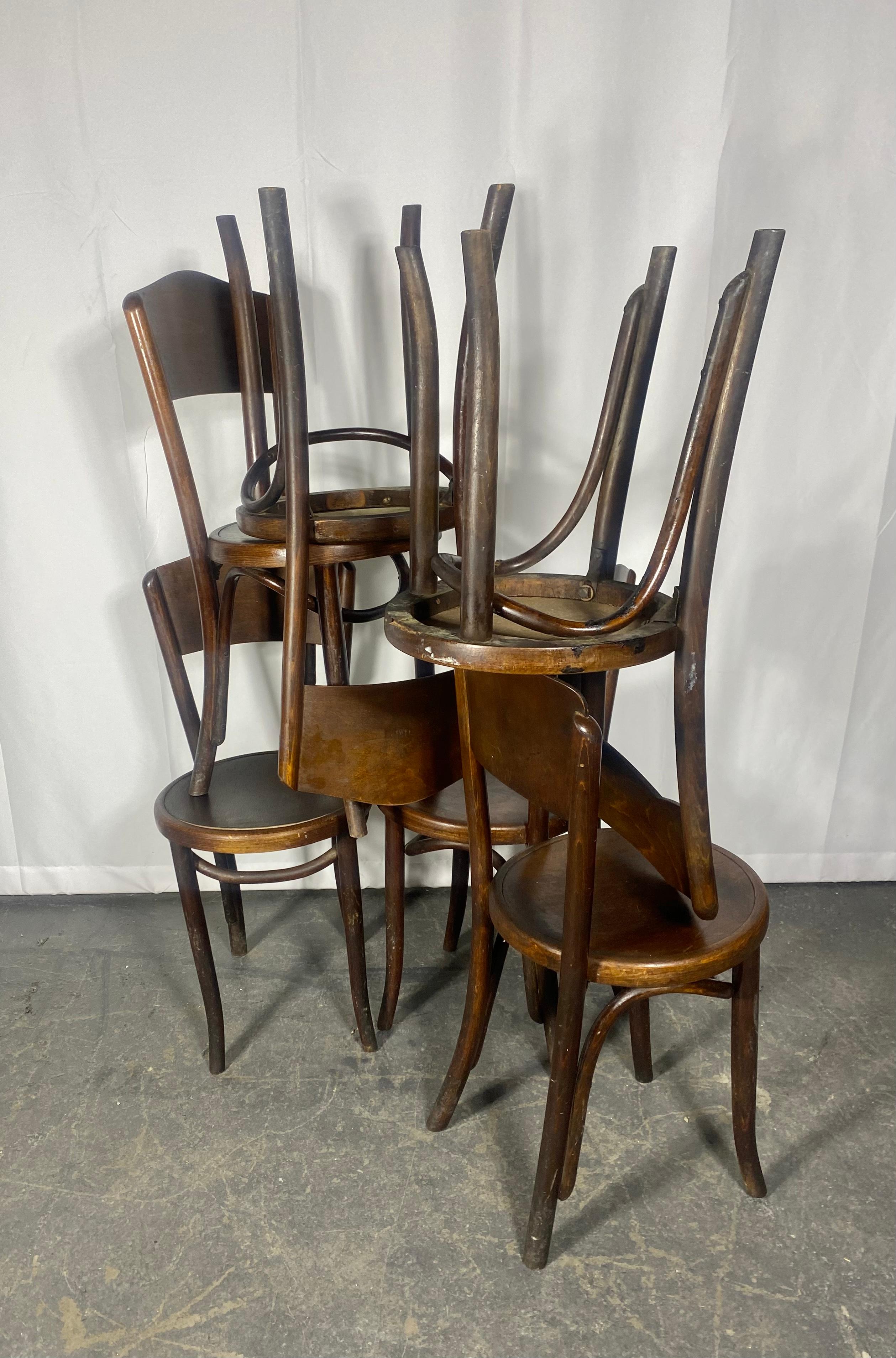  
Set of six Fischel Vienna dining chairs in bentwood with striped pattern on seat and backrest.
These Art Nouveau cafe chairs are model 45 and were made in the Czech Republic in the 1920s. They are labelled with original makers label.
Thonet style.