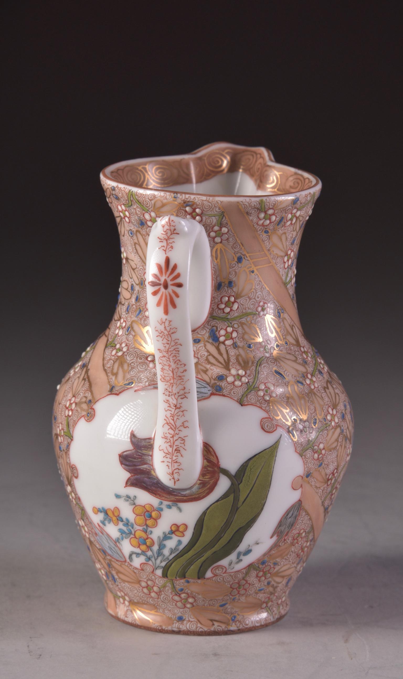 Very rare piece by Fischer Vilmos, porcelain milk pitcher. 
With gorgeous flowers and gold coloured handicrafts.