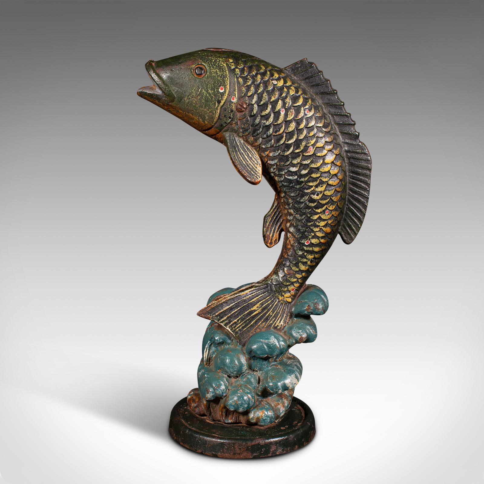 This is an antique fish statue. An English, cast iron angler's doorstop, dating to the late Victorian period, circa 1900.

Striking leaping carp figure with great colour
Displays a desirable aged patina and in good order
Hand-painted cast iron