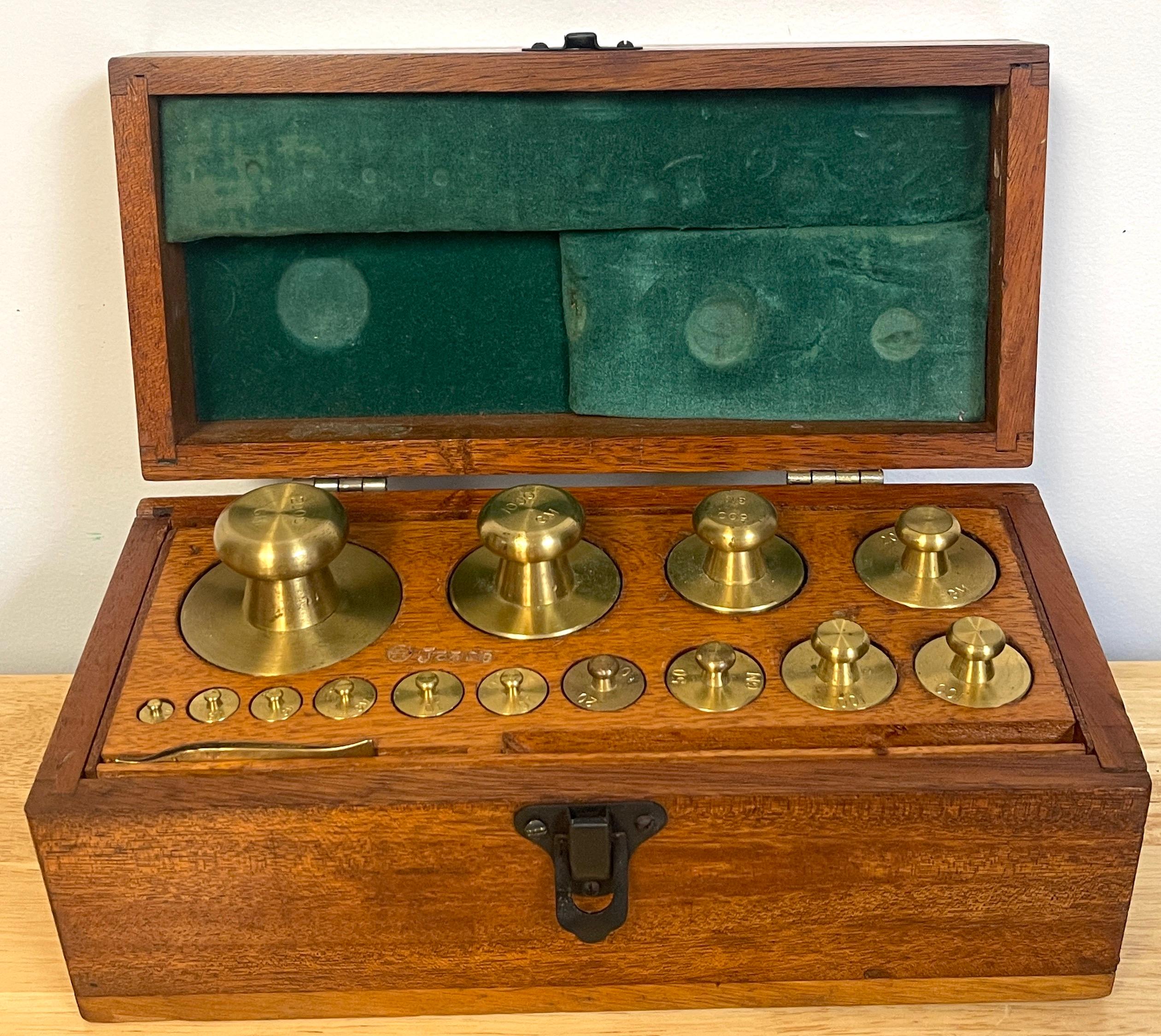 Antique Fisher- Scientific Brass & Oak Complete Calibration Weight Set
USA, Circa 1940s 

Originating from the USA, with locations in Canada and dating back to the 1940s, this is a rare and remarkable find—a complete 15-piece set of solid brass