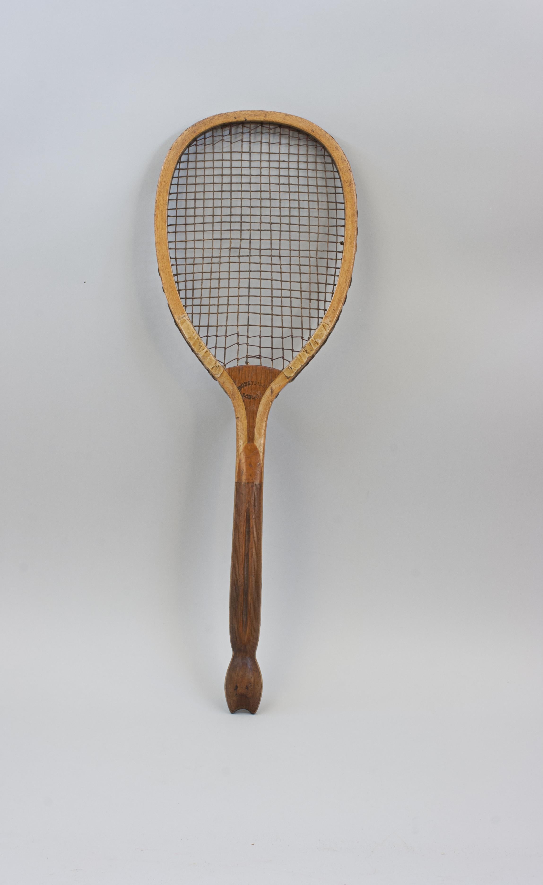 Wooden Prosser & Sons Fishtail Tennis Racket.
A lawn tennis racket by T.H. Prosser & Sons with nice ash frame with convex walnut wedge. The wedge is stamped with the makers name in gilt 'T.H. Prosser & Sons' on one side and the retails stamp on the