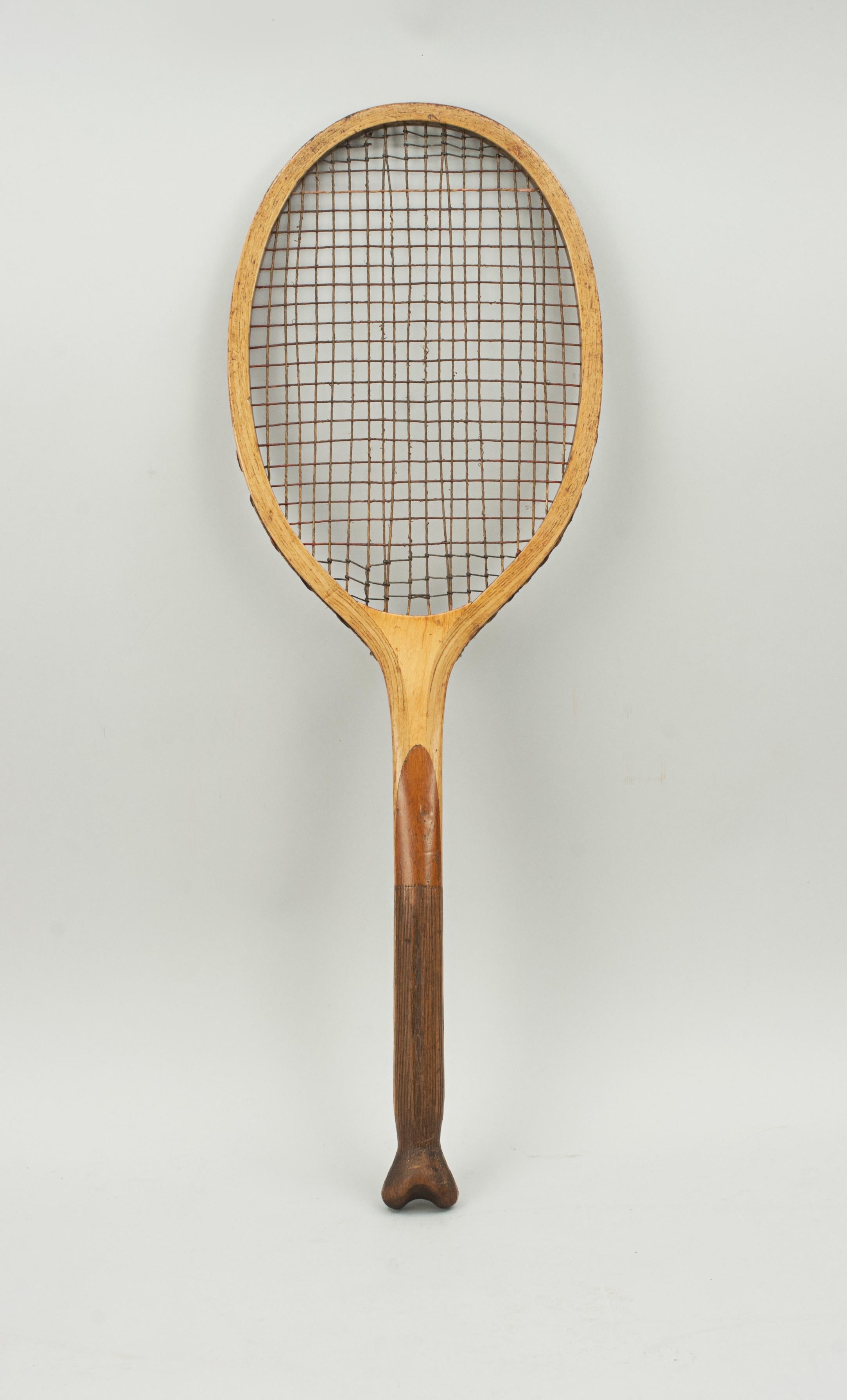 The 'Radian' Wooden Framed Lawn Tennis Racket.
A good wooden framed tennis racket called The 'Radian'. The concave throat with embossed name in gilt 'Radian', on the side of the fishtail handle is the retailer's name, Leuks, Market Street. The ash