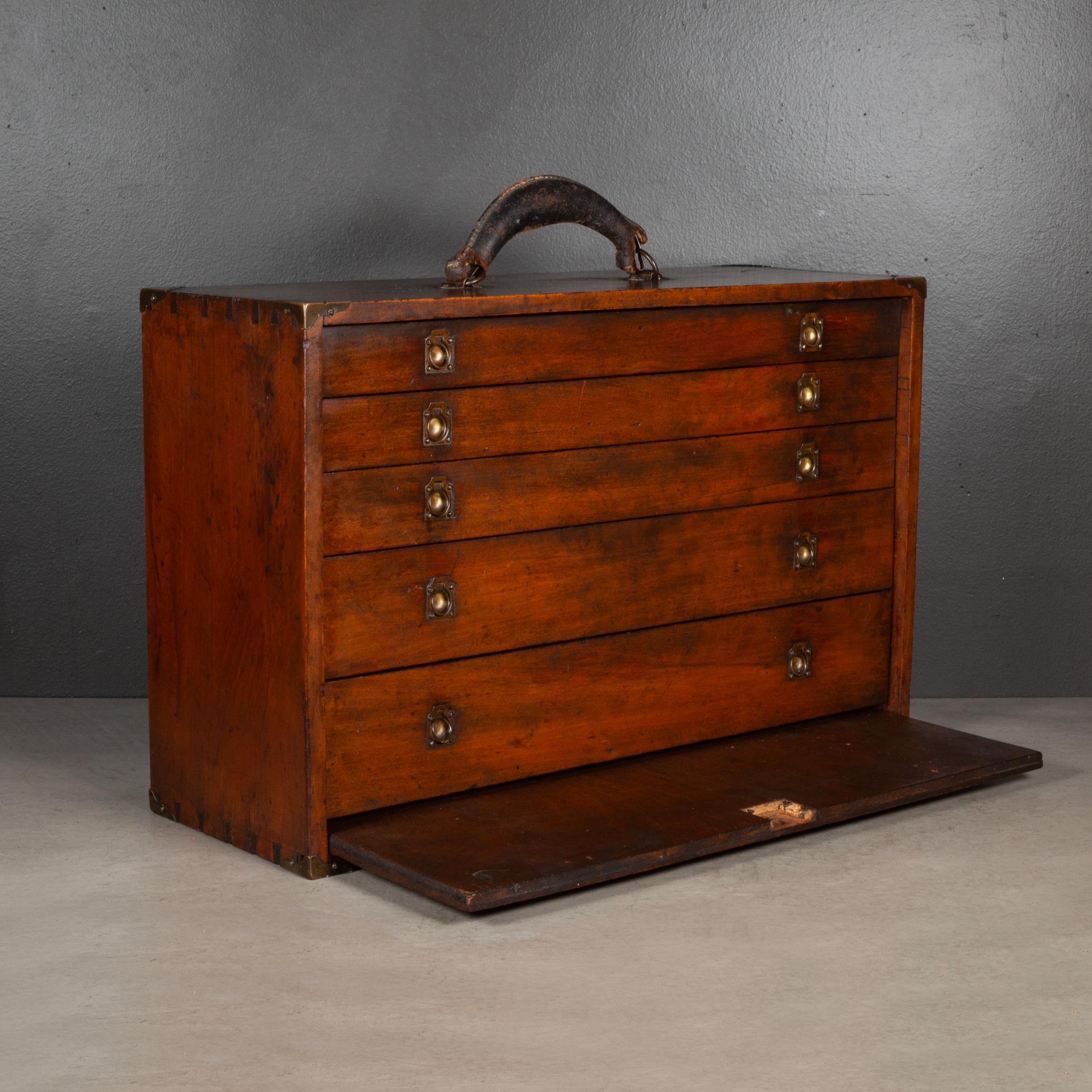 ABOUT

An antique Machinist's tool chest with round brass pulls, Five graduated drawers with Mahogany fronts, brass corners and a pull out Mahogany front cover. Top drawer has three segments. Dovetail construction. 

    CREATOR Unknown. 
    DATE