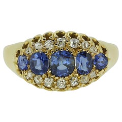 Anello antico a cinque pietre con zaffiro e diamante