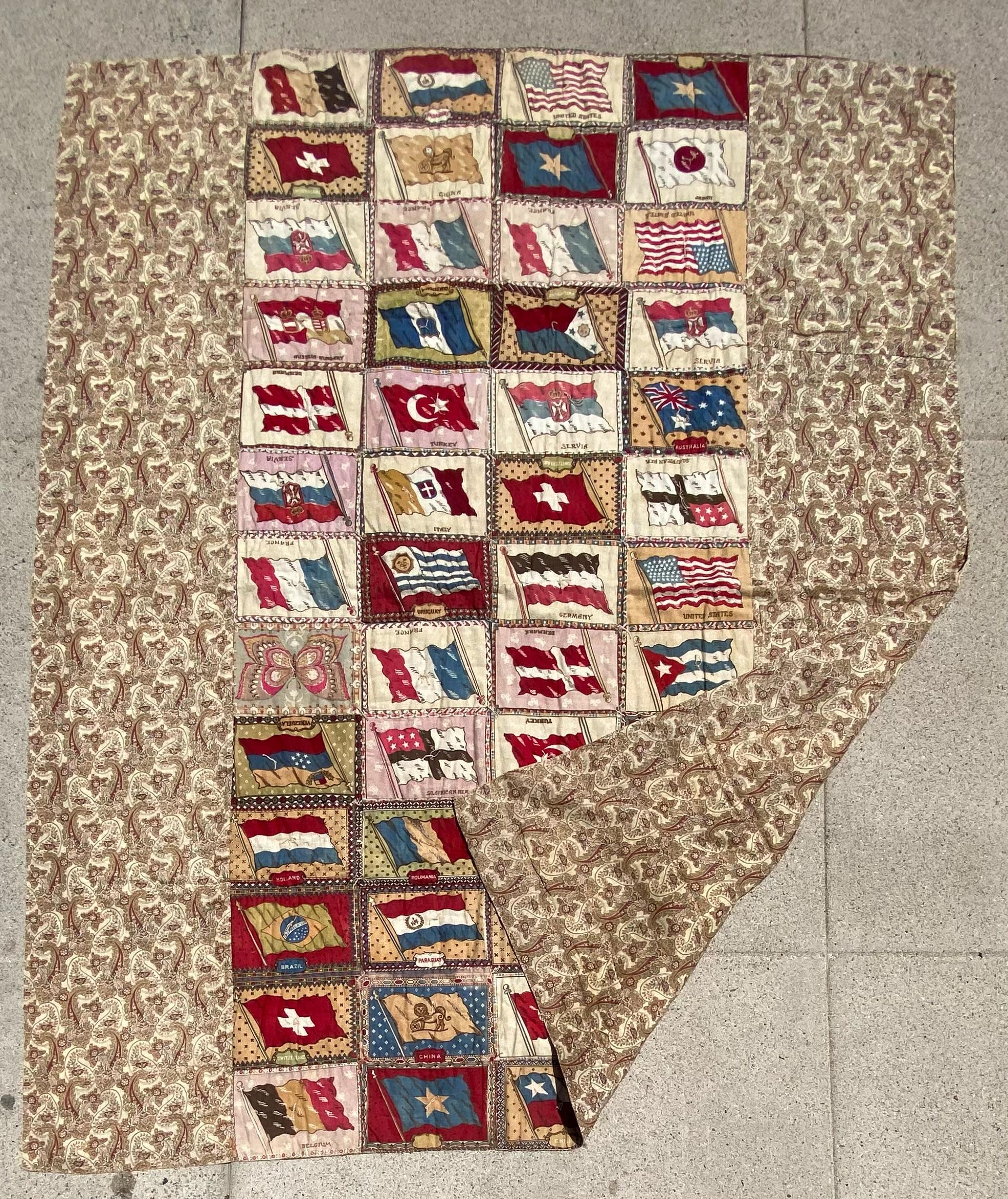 This fine antique flag flannel quilt has a paisley back round and backing.The flag flannels are from cigar premiums. The quilts in very good condition.