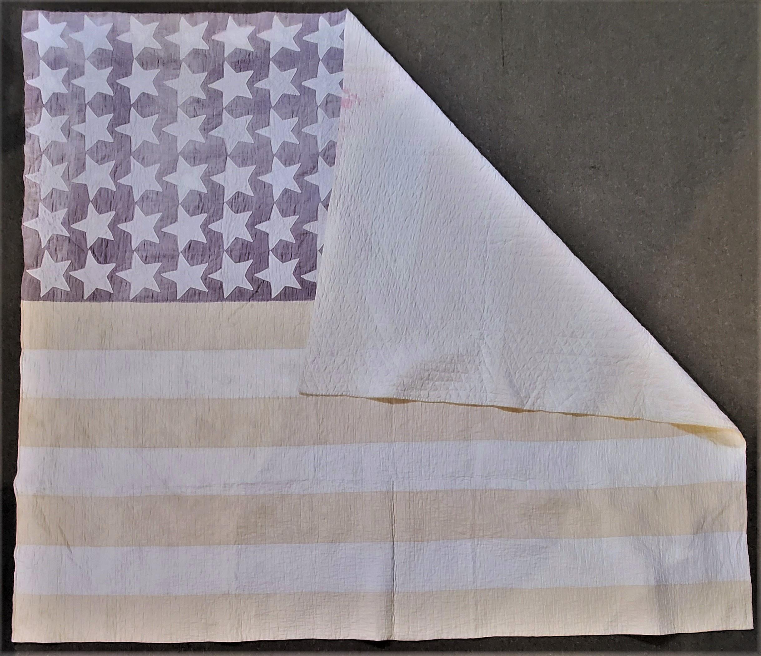 This hand sewn 48 stars flag quilt is in good condition with minor tiny little repairs and evenly faded. It is such a great look for a ranch or cabin retreat. It is in a polished cotton fabric and has hand sewn stars. The stars have quilted stars