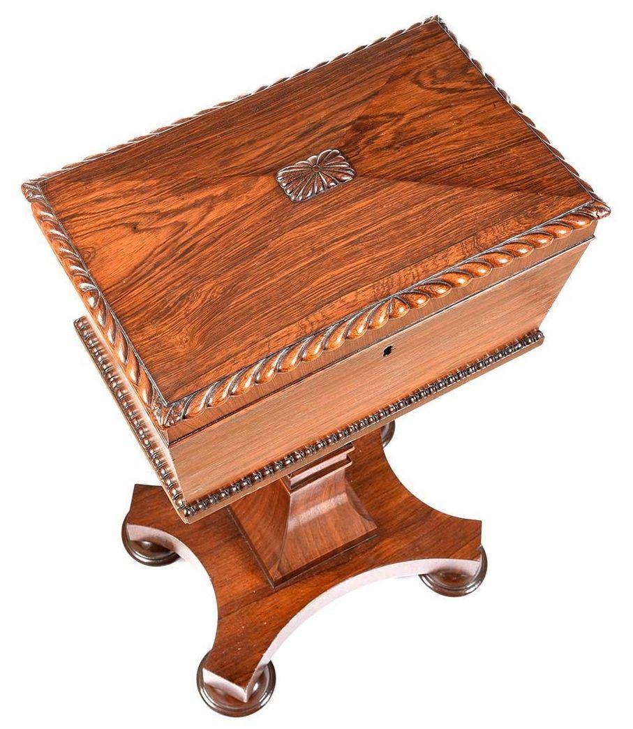 An exceptionally fine quality English Regency Period well figured mahogany Teapoy, raised on its original stand, firmly attributed to Gillows of Lancaster and London. First quarter of the nineteenth century. 

The hinged dome shaped lid with