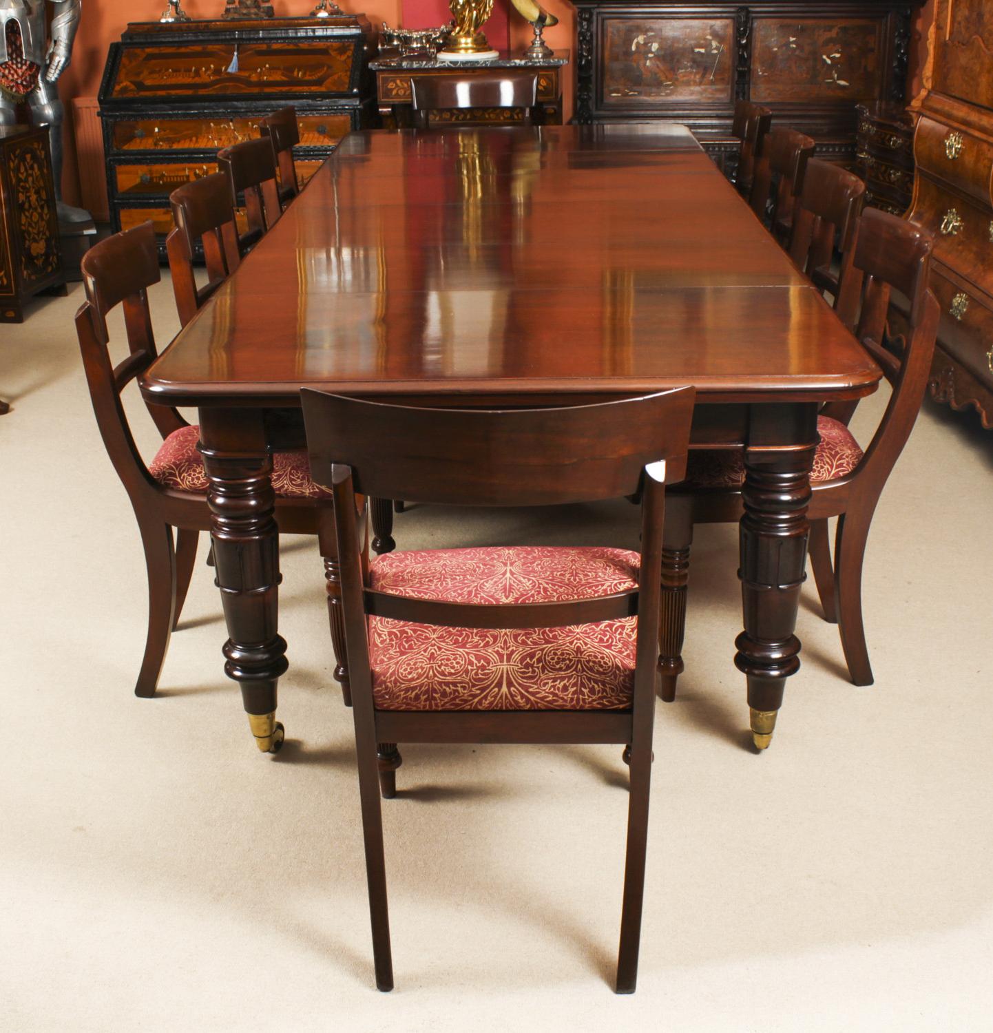 This is a beautiful dining set comprising an antique William IV flame mahogany mahogany dining table and a beautiful set of ten William IV barback dining chairs, all Circa 1830 in date. 

The beautifully figured flame mahogany table has four