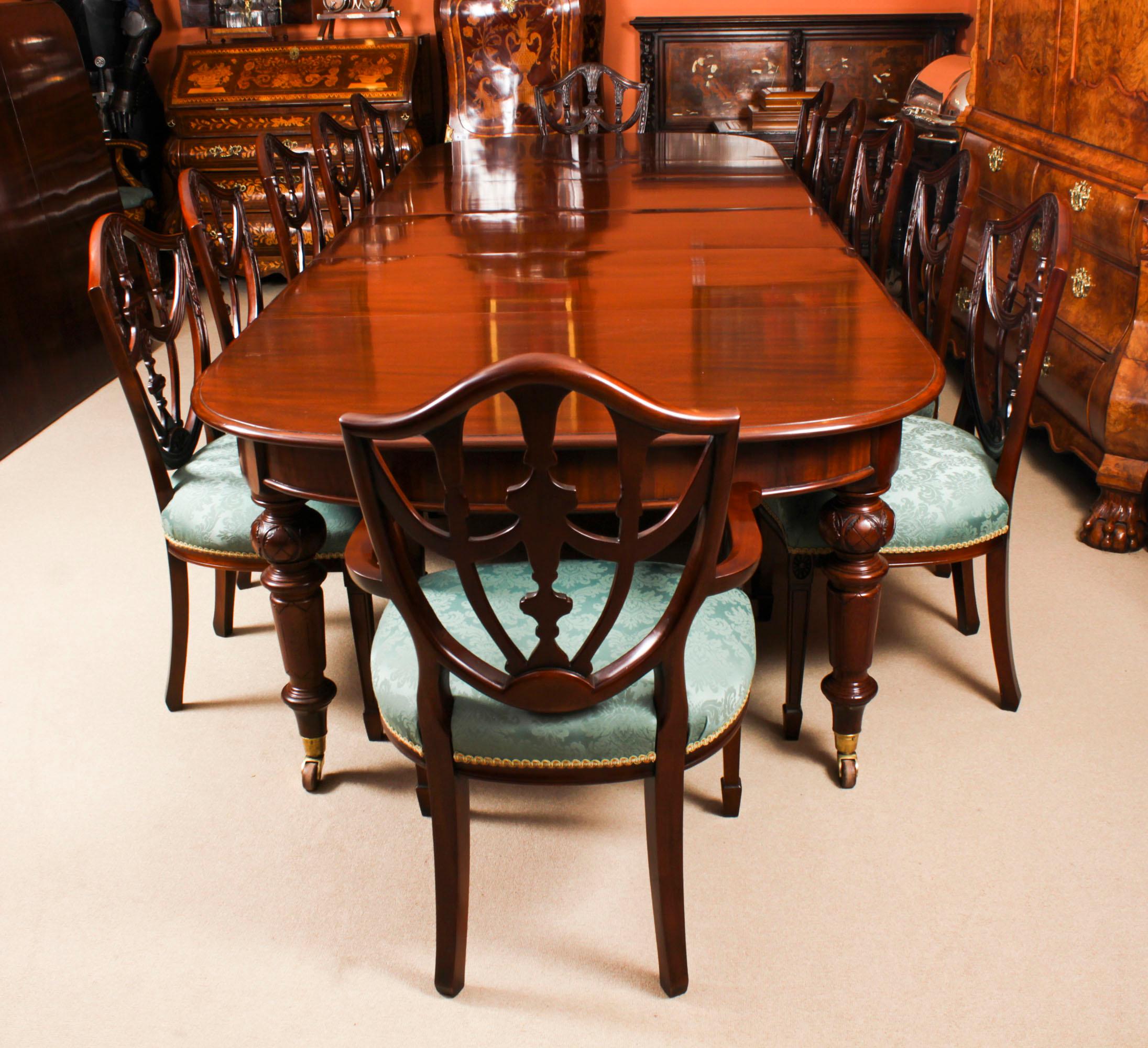 This is a superb antique Victorian flame mahogany dining table, Circa 1860 in date and twelve vintage shieldback dining chairs.

This amazing table can seat twelve people in comfort and has been hand-crafted from solid mahogany.

This superb table